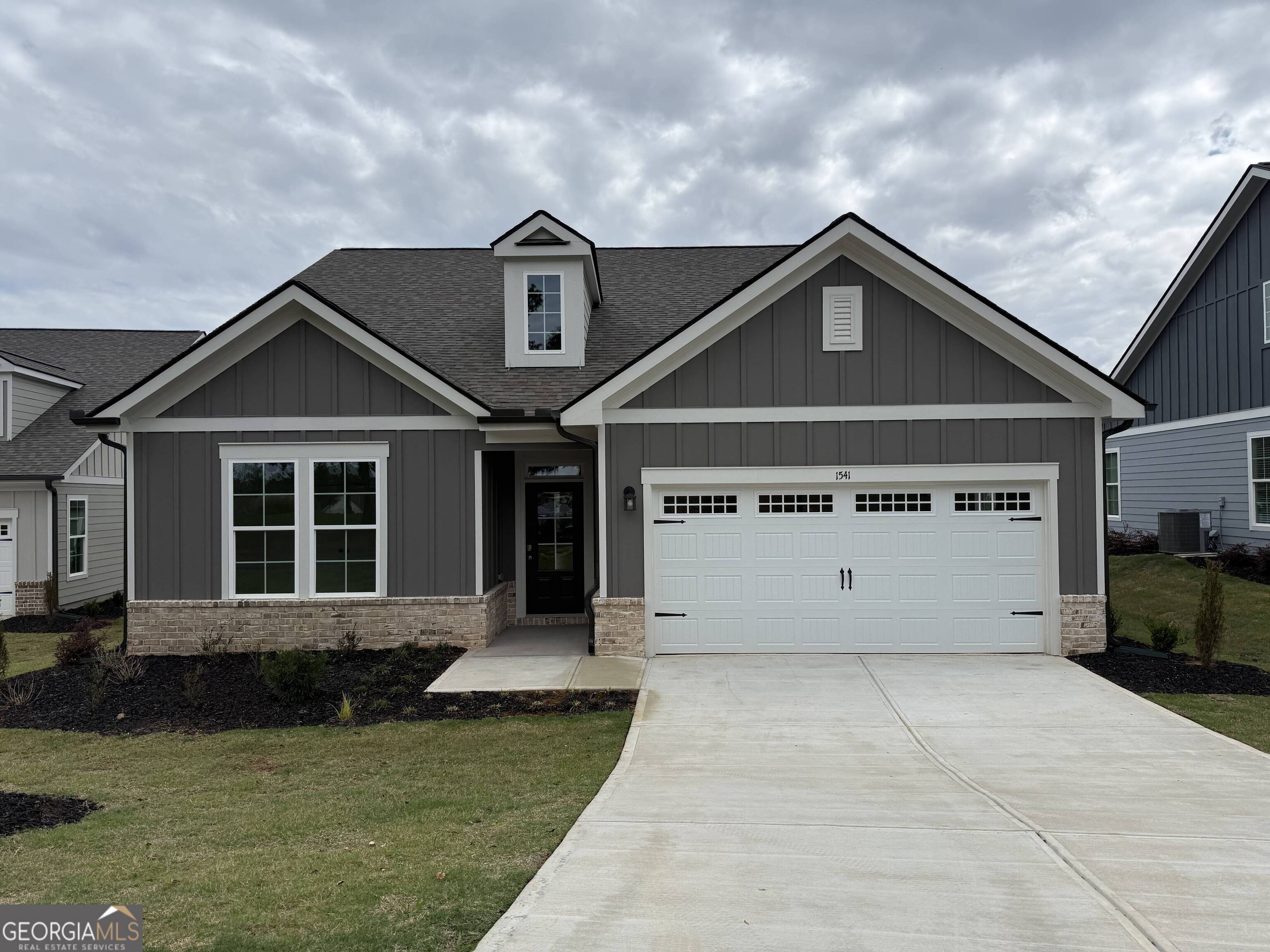 Welcome to The Enclave at Heron Ridge - your perfect introduction to the coveted gated and lake lifestyle at Harbor Club on Lake Oconee. This thoughtfully designed ranch plan offers all three bedrooms conveniently on the main level, making it an ideal getaway retreat or a comfortable downsize option. Step inside and you'll find spacious bedrooms, a primary suite with a huge walk-in closet, and a spa-like bath featuring a garden tub and separate shower. The kitchen shines with quartz countertops, while the covered back porch overlooks a generous backyard complete with professional privacy plantings-perfect for relaxing or entertaining. At Harbor Club, you'll enjoy an exceptional range of amenities: gated security, championship golf, lake access, a marina with boat storage, clubhouse, dining, social events, and so much more. Don't miss your chance to live the Lake Oconee lifestyle. Call today and make The Enclave at Heron Ridge your new home!