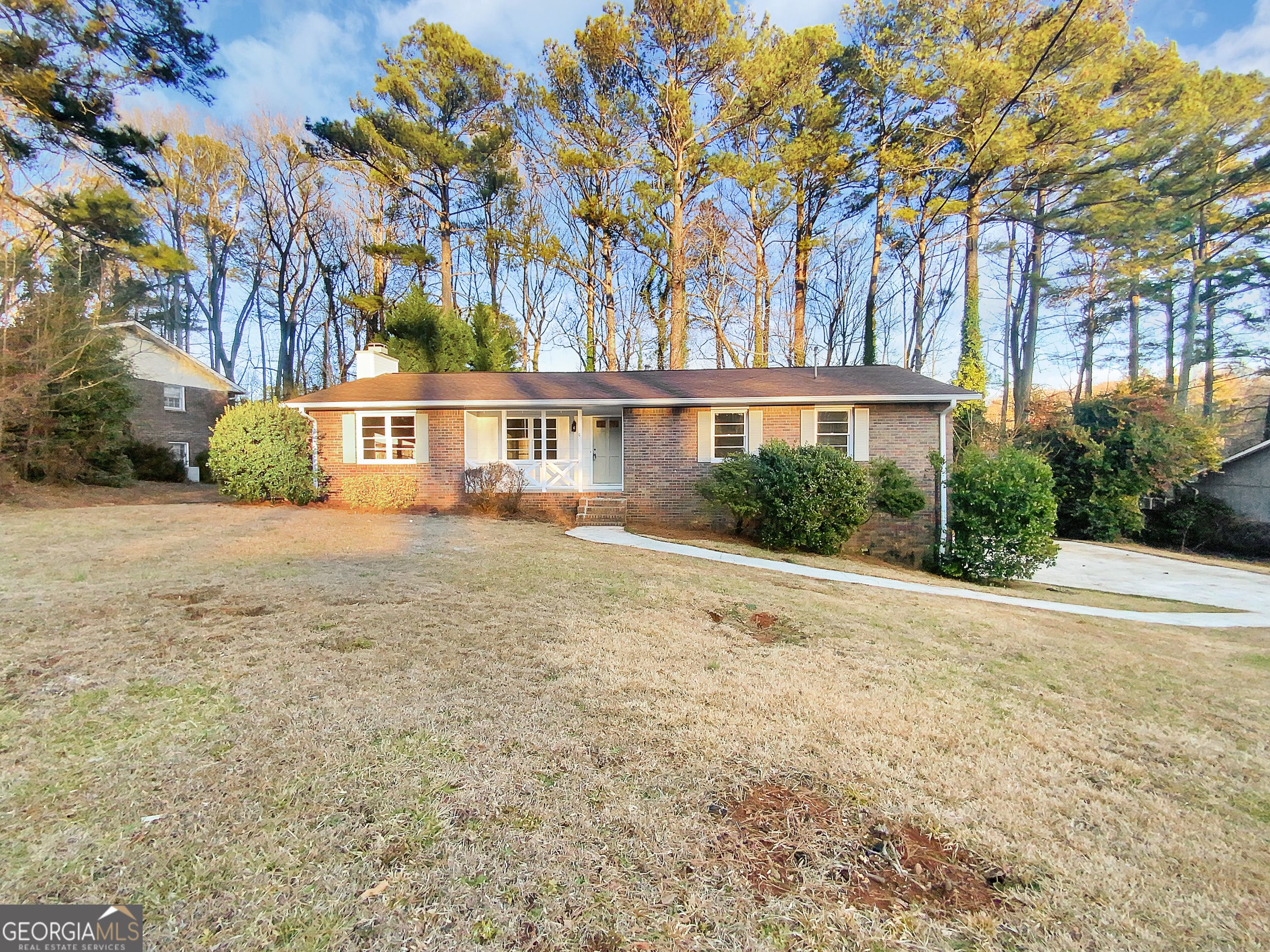 Welcome home to this charming 3-bedroom, 2-bath haven nestled in the heart of the highly sought-after East Cobb neighborhood. This picturesque 4-sided brick residence boasts a classic exterior that exudes timeless elegance. Step inside to discover new, plush carpeting throughout, providing a sense of luxury and comfort. The kitchen is a chef's delight with its stunning white cabinets that stand the test of time, complemented by sleek black appliances that add a modern touch. The spacious great room is a perfect gathering spot, featuring a unique stone fireplace that adds character and warmth to the living space. Take the indoor-outdoor living experience to the next level with a deck overlooking the expansive backyard. Ideal for entertaining or simply enjoying a quiet morning coffee, the deck offers a serene retreat surrounded by nature. Unleash your creativity in the unfinished basement, a blank canvas awaiting your personal touch. The convenience of a 2-car garage adds practicality to this space, ensuring ample room for parking and storage. Located in a prime East Cobb location, this home combines comfort, style, and functionality. Don't miss the opportunity to make this gem yours and experience the epitome of East Cobb living. Schedule your showing today and envision the possibilities that await in this delightful home.