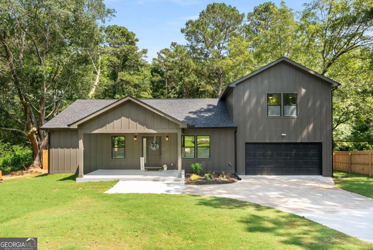Dreaming of summer nights by the pool and a home that's brand new from top to bottom? This newly built 4-bedroom, 3-bath home in Douglasville sits on over half an acre and delivers the perfect blend of modern design, space, and functionality. From the moment you arrive, the crisp board and batten siding and professionally landscaped yard set the tone for what's inside. Step through the front door to find a spacious open-concept layout that flows effortlessly from the living room to the dining area and into a sleek, modern kitchen. With stylish finishes, stainless steel appliances, and plenty of room to gather, it's built for both daily living and entertaining. Upstairs features a kitchenette, offering ideal flexibility for multi-generational living, guest accommodations, or rental potential. Whether you need space for in-laws, a teen suite, an Airbnb setup, or a Home Office, this home is ready. The private backyard is the ultimate retreat, with a pool as the highlight, surrounded by lush landscaping and a newly built wood privacy fence. Grill out, lounge poolside, or host unforgettable gatherings in a space made for making memories. The two-car garage provides ample storage and convenience, and every detail in this home was carefully crafted with comfort and lifestyle in mind. Located just minutes from shopping, dining, parks, and major highways, this is a rare opportunity to own a move-in-ready new construction home in Douglasville.