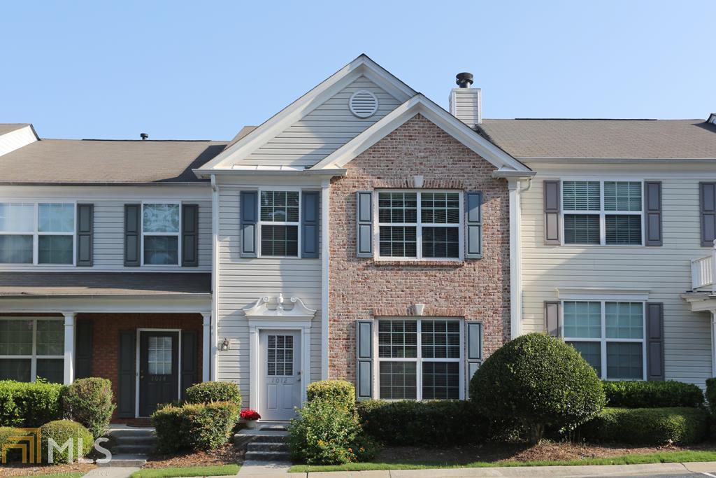 Pristine 3 Br 2 & Half Bath Townhome. Renovated Kitchen w/ Granite Counter Tops, Glass Tile Back Splash, Stainless Appliances. Kitchen opens to Dining Room and Fireside Great Room. New Hardwood Floor on Main, New Carpet Upstairs, and Just Painted. Vaulted Ceilings in Master Bedroom, Large Walk-In Closet. Large Master Bath w/ Double Vanity. 2 Assigned Parking Spaces. Convenience of Alpharetta with Forsyth Taxes. Neighborhood has 2 Pools & Dog Park