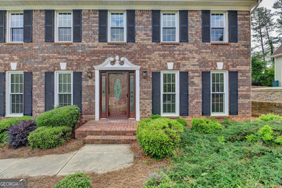 A Rare Opportunity in East Cobb's Coveted Wheeler High School District! This beautifully maintained home is nestled in a perfect location and offers a rare combination of charm, privacy, and modern updates. Step into a spacious living area featuring rich wood panel accent walls and elegant custom wood moldings that add timeless character and sophistication throughout the home. The updated vinyl double-pane windows, newer roof, and HVAC system ensure comfort and efficiency year-round. Enjoy peaceful mornings or relaxing evenings on the extended deck and covered patio overlooking the serene, private backyard Co perfect for entertaining or unwinding in nature. 4beds/ 2.5bath with the oversized primary suite features a dedicated office space that can also serve as a quiet retreat or a flexible bonus area for hobbies or gatherings. Located in a quiet, well-established neighborhood offering swim and tennis amenities, this home provides not only beauty and comfort, but also a vibrant community lifestyle. Don't miss this rare chance to own a truly special home in one of East CobbCOs most sought-after communities!