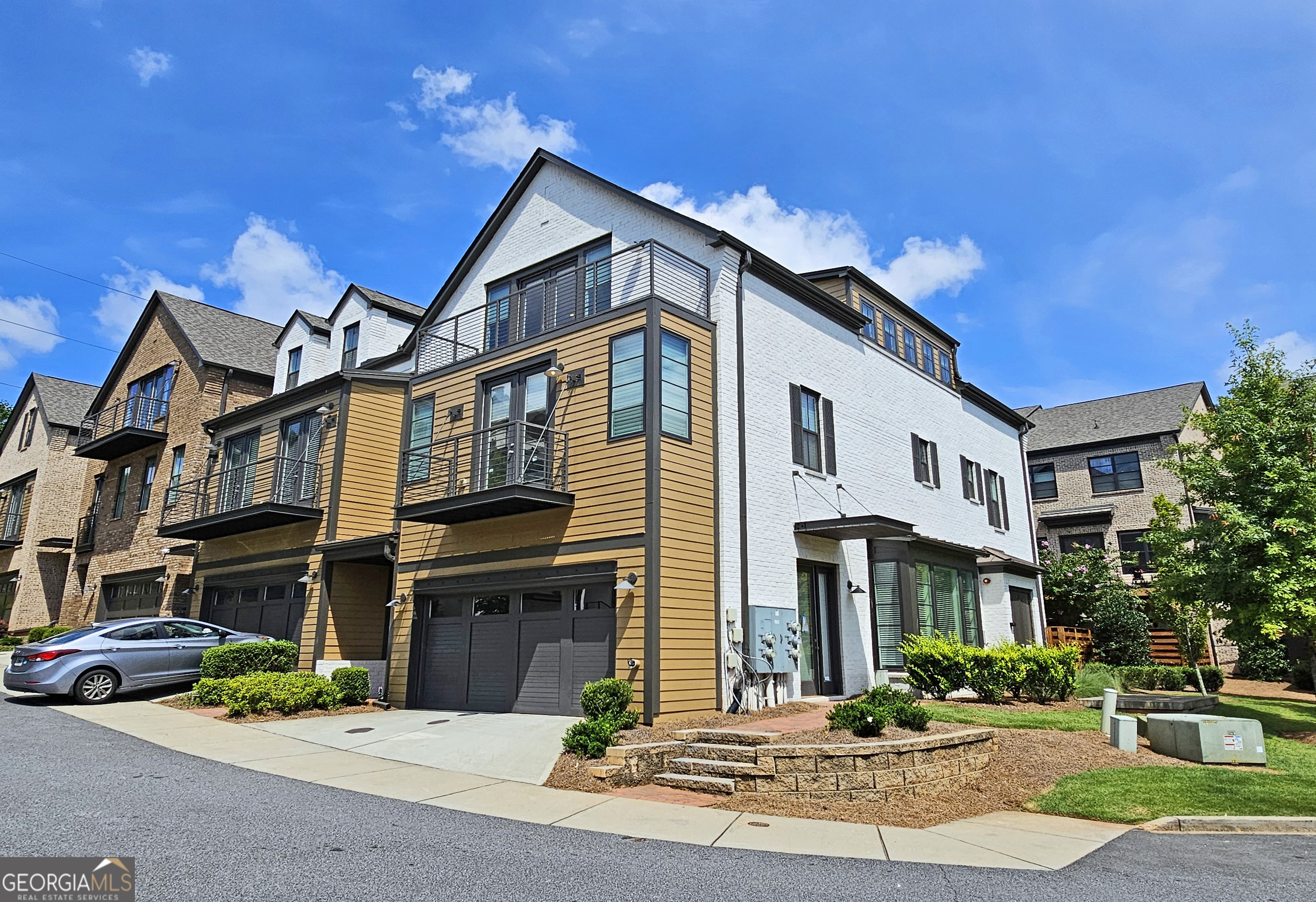 Experience luxury living in the highly sought-after gated Overture at Encore community. Within walking distance to Ameris Amphitheater, shops, and restaurants, this property has it all. The spacious first floor includes a gourmet kitchen, dining room, and large fireside living room. The second floor has three good sized bedrooms, and 2 nicely appointed bathrooms. The owner's suite features a soaking tub, a frameless shower, and sophisticated finishes. The large 3rd floor flexible space includes 3 additional living spaces and a full bathroom. This area is perfect for many uses such as an additional bedroom, home office, gym, media room, or personalized retreat. There are large storage closets on every level! All 3 levels have beautiful hardwoods with plush carpeting in the bedrooms. The community has a secure gated entrance, a community pool, gathering area and a quiet park, ideal for both relaxation and social engagements.