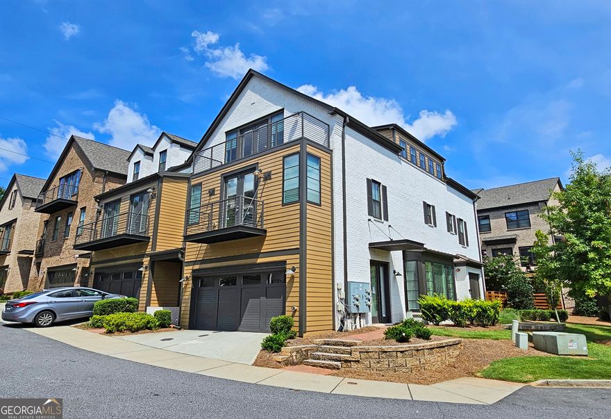 Experience luxury living in the highly sought-after gated Overture at Encore community. Within walking distance to Ameris Amphitheater, shops, and restaurants, this property has it all. The spacious first floor includes a gourmet kitchen, dining room, and large fireside living room. The second floor has three good sized bedrooms, and 2 nicely appointed bathrooms. The owner's suite features a soaking tub, a frameless shower, and sophisticated finishes. The large 3rd floor flexible space includes 3 additional living spaces and a full bathroom. This area is perfect for many uses such as an additional bedroom, home office, gym, media room, or personalized retreat. There are large storage closets on every level! All 3 levels have beautiful hardwoods with plush carpeting in the bedrooms.  The community has a secure gated entrance, a community pool, gathering area and a quiet park, ideal for both relaxation and social engagements.
