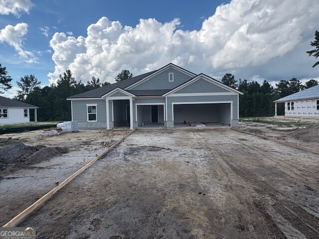 Step into your new life at this beautifully crafted home in the heart of the Northshore community. This 3 Bed, 3 bath, 3 Car Garage 2470 sq ft One Story Single Family Home on a 1/2 Acre Homesite is ready for an October/November Completion date. This home has it all being on a huge estate lot in a gated community that backs up to a pond. This home has a huge backyard with a large amount of open space back to your pond. Quartz throughout including chef kitchen, primary bathroom and secondary bathrooms, LVP flooring everywhere except the bedrooms, Shaw carpet in the bedrooms. Chef Kitchen has tiled kitchen backsplash along with tile throughout in the primary bathroom. Whirlpool Stainless steel appliances in Microwave/Wall Oven, Dishwasher, and Stainless Steel Hood Vented Outside. The Family Room will have a nice Shiplap electric fireplace built out. The exterior of this Everglade Floor Plan will have stone and a nice large wide driveway to accommodate the 3 car garage. Northshore community, having estate size lots, has a community outdoor screened clubhouse, boat access with a dock, playground, basketball court, front and rear gates and is very private and secluded along the St Mary's River. Colors and Options may vary. Contact onsite sales with questions.