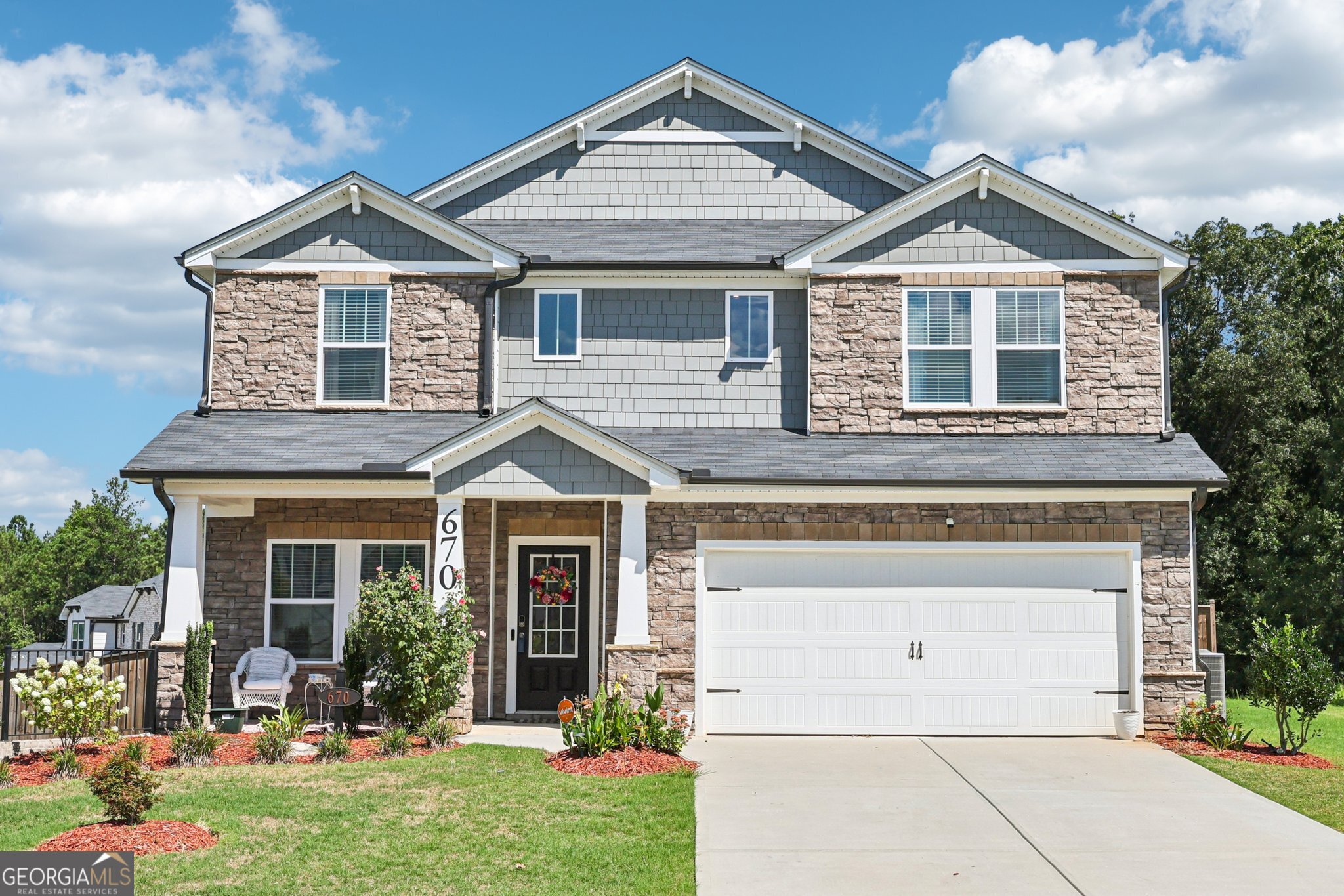 Welcome to 670 Sara Meadow Rd, Loganville, GA 30052 - A Stunning 5-Bedroom Home on a Spacious Corner Lot! Step into this beautifully maintained residence featuring a grand two-story foyer and a formal dining room perfect for entertaining. The heart of the home is the gorgeous white kitchen, complete with updated appliances, a large island with breakfast bar seating, and open views to the fireside living room-ideal for everyday living and hosting guests. The main level offers a private bedroom and full bathroom, perfect for guests or multi-generational living. Upstairs, a versatile loft provides the perfect space for a home office, media room, or play area. Retreat to the expansive primary suite with a spa-like ensuite bathroom featuring a separate shower, soaking tub, double vanity, and a large custom walk-in closet. Three additional spacious bedrooms and a third full bathroom complete the upper level. Enjoy outdoor living in the huge, fenced-in backyard with a patio-perfect for grilling, entertaining, or relaxing in privacy. Located in a quiet neighborhood with convenient access to local schools, parks, and shopping, this home is the total package. Don't miss your opportunity to make it yours!
