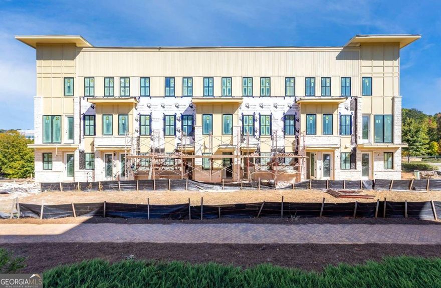 Welcome to your new condo flat in Monte Hewett's newest neighborhood in Alpharetta, Findley Row! This is a rare opportunity to find your new end unit condominium built by the same builder that designed the homes in Avalon, Halcyon and many other well-known neighborhoods throughout Atlanta.  As you walk in the front door you will see the luxurious White Oak Hardwood floors that carry throughout the home, Quartz countertops in the Kitchen and bathrooms, Bell custom cabinetry, tile to the ceilings in the bathrooms and so many more high end finishes. The Kitchen features a large island with plenty of room for entertainment and a walk-in pantry for great storage. The main floor entrance on the front of the building has all of your great living space on one level including your covered patio and bedrooms. The professionally designed bathrooms are the perfect color combinations. You will head downstairs for the oversize two-car tandem garage that offers private parking with tall ceilings that are perfect for storage. Findley Row is located in Northwinds Summit that will feature a hotel, retail, dining and office space, as well as very convenient access to GA-400. Enjoy the Alpharetta location without the local traffic.  The first 3 buyers will enjoy $10,000 Seller paid closing costs when you sign your new home agreement in January. Contact us to schedule a private showing and experience the exceptional lifestyle you will enjoy in Findley Row!