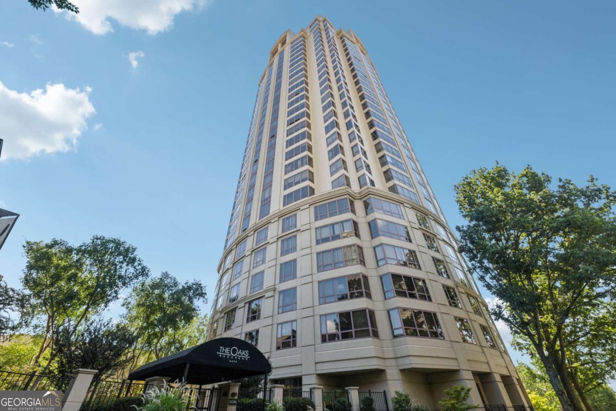Enjoy breathtaking, unobstructed views of the Atlanta skyline from this beautiful 2-bedroom high-rise condo at The Oaks at Buckhead-one of the city's premier addresses. Floor-to-ceiling windows flood the open-concept living space with natural light, while hardwood floors throughout and crown moulding add warmth and sophistication. The modern kitchen boasts sleek dark cabinetry, crisp white countertops, and stainless steel appliances. A breakfast bar opens to the living area, perfect for entertaining, while marble-look floors and crown molding add a touch of elegance. Ample storage and counter space make it as functional as it is stylish. The dining area flows seamlessly into a spacious living room with panoramic windows. The two bright and spacious bedrooms are located on opposite sides of the main living area. Practical features include deeded parking in the secure gated garage and a rare private storage unit. Residents of The Oaks at Buckhead enjoy world-class amenities: 24/7 concierge and security, complimentary guest parking, guest suite accommodations, a resort-style saltwater pool, hot tub, sauna, state-of-the-art fitness center, elegant club room with bar and catering kitchen, theatre room, business center, four sun terraces, gas grilling patio, landscaped courtyard with walking paths. Unbeatable location-just steps from Lenox Mall, Phipps Plaza, Whole Foods, Trader Joe's, and some of Atlanta's best dining. Easy access to two MARTA stations, GA-400, I-85, and Hartsfield-Jackson Airport. This isn't just a home-it's a lifestyle in the heart of Buckhead. Schedule your private tour today and discover why The Oaks at Buckhead remains one of Atlanta's most sought-after communities.
