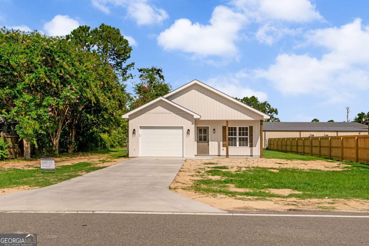 This beautiful new construction home offers 1,292 square feet of heated space, featuring three bedrooms and two baths. Inside, you'll find upgraded luxury vinyl flooring, custom-built cabinets, upgraded fixtures, and a kitchen equipped with sleek stainless-steel appliances, along with a convenient pantry. The home also boasts a spacious master closet, a dedicated laundry room, a one-car garage, and both a front and back porch for your relaxation
