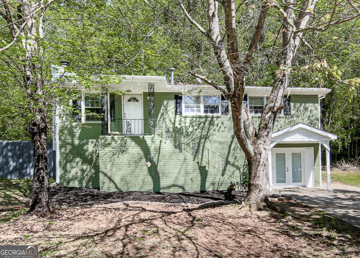 Get two homes for the price of one! This beautifully renovated, income-producing duplex is perfect for families seeking an in-law suite or savvy investors looking for immediate cash flow. Both units are currently rented through Section 8 at $1,670/month each, generating $3,340/month in guaranteed rent. Located in the heart of the East-West Connector, you'll have eacy access to shopping, parks, dining, and entertainment--making this property attractive to both tenants and future homeowners. The top unit is a 2-bed, 2-bath featuring an updated kitchen with painted cabinets, new granite countertops, and tile backsplash. It also includes new luxury vinyl plank flooring throughout the living room, hallway, breakfast area, and bedrooms. The bathroom has been renovated. Step onto your back porch and relax with the view of the woods. Just a couple of steps down, there is a level fenced in yard primed for gardening or other outdoor activities. The bottom unit, with separate access, offers 2 bedrooms, 1 bath, a brand-new kitchen, updated bathroom, new light fixtures, and a dedicated laundry area. Each unit includes its own set of appliances-gas stove, refrigerator, and dishwasher. A new roof will be installed prior to closing, offering added peace of mind. Step out onto the back porch and relax with a wooded view. The level, fenced in backyard offers space for gardening, pets, or entertaining. Whether you're an investor, multigenerational household, or buyer looking to house hack, this property is turnkey, tenant-occupied, and located in a quiet neighborhood with no HOA. Don't miss this opportunity to own a renovated duplex that delivers both flexibility and consistent income!