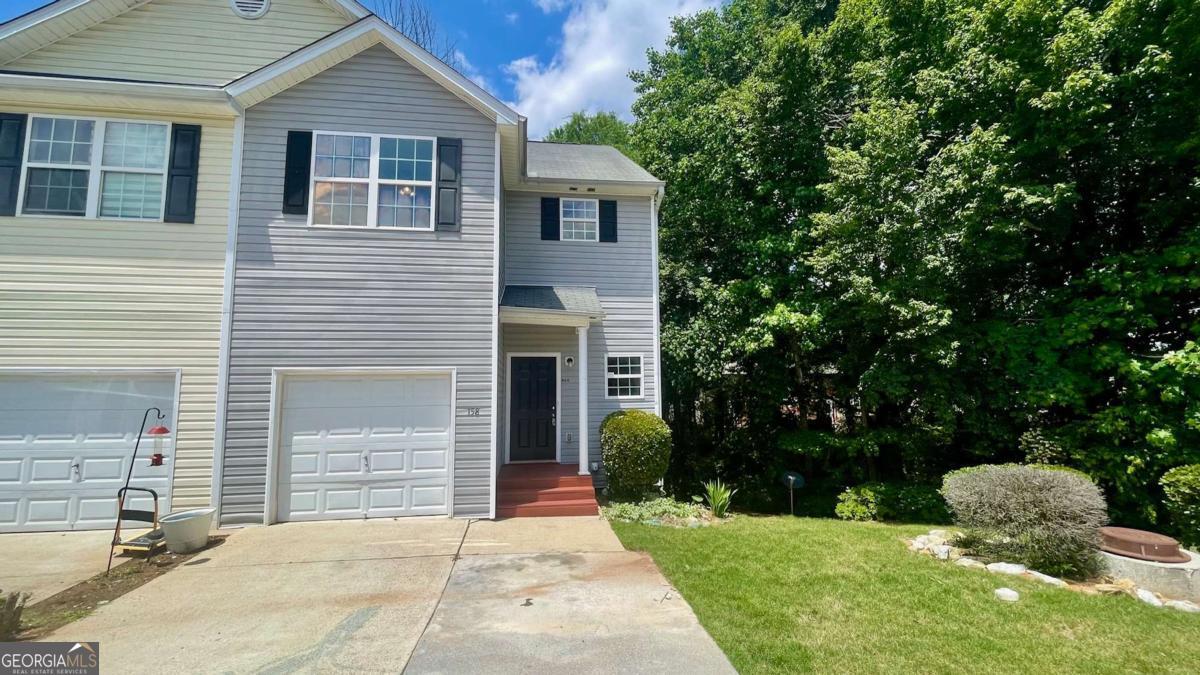 Spacious 3BR/2.5BA Townhome in the Heart of Hiram! Tucked away in a quiet, well-maintained community just minutes from Downtown Hiram, this roomy townhome offers comfort and convenience in an ideal location. Step inside from the welcoming front porch stoop into a large, open-concept living and dining area that flows seamlessly into a bright kitchen featuring white wood cabinetry, a walk-in pantry, generous breakfast bar, LVP flooring, and included stainless steel appliances (range, dishwasher, and microwave) along with a small private deck in the back, perfect for a grill and a couple of chairs overlooking a wooded backyard. Downstairs includes a full basement partially finished perfect for recreational space and storage! Upstairs, you'll find a spacious primary suite with an en suite bathroom, two additional bedrooms, a second full bath, and a laundry closet for added convenience. Parking is a breeze with a dedicated 2-car parking pad right out front and a 1 car garage also perfect for storage. This home is perfectly situated near local dining, shopping, and groceries-including Walmart-and offers easy access to everything downtown Hiram has to offer. Simple application process. yard maintenance, trash, water included. Contact us today for more details or to schedule a showing!