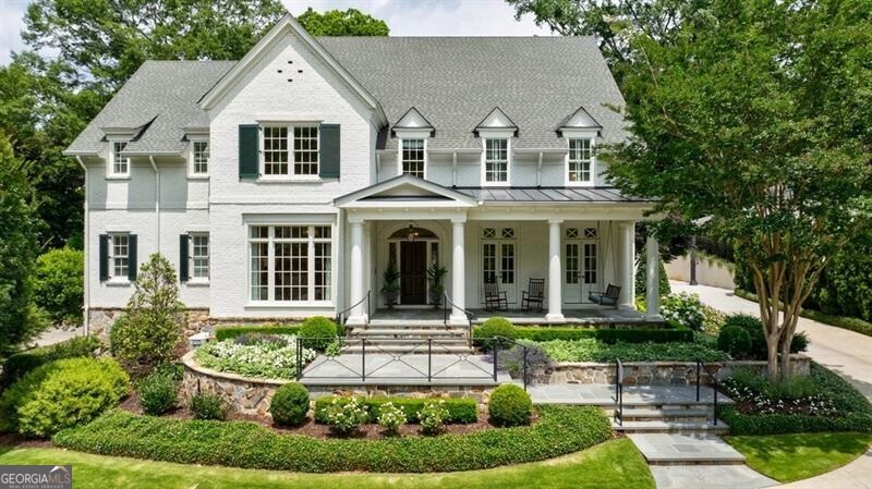 Gorgeous Traditional home on coveted and revered Argonne Drive. Great curb appeal with manicured landscaping and large covered front porch. Entrance foyer leads to formal dining room and living room. Large kitchen opens to the breakfast area and cozy keeping room with stone fireplace. Kitchen has marble counters, stainless steel appliances and island. Kitchen also opens to the family room with French Doors leading out to the covered patio. Conveniently located off the 2 garage is a mudroom with built-in lockers, half bath, and side entry. Guest suite on main with large en-suite bath. Upper level staircase leads to 3 bedrooms all with en-suite baths. Great bonus room and laundry on upper level as well. Separate staircase over the garage has a full apartment ideal for an au-pair suite or in-law suite. It is complete with living room, full kitchen, washer and dry, separate bedroom and full bathroom. Finished terrace level offers gym, full bath, media room with kitchenette. The level backyard is truly breathtaking. Mature landscaping throughout, covered porch and grilling area. This home is truly a must see in Argonne Forest!