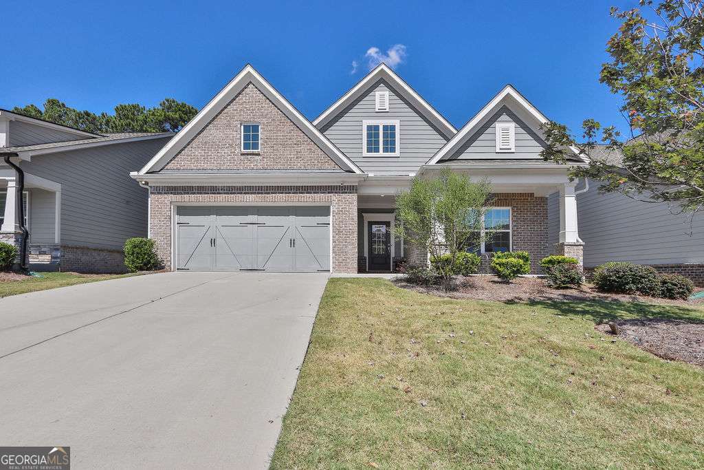 Welcome to 567 Barlow Place- 55+ community where modern comfort meets timeless charm in the heart of Grayson! Built in 2021, this beautifully maintained 3-bedroom, 3-bath home offers over thoughtfully designed living space. The open-concept layout features a spacious family room with a masonry fireplace, a gourmet kitchen with premium finishes, and generous natural light throughout. Enjoy a luxurious primary suite with a walk-in closet, plus two additional bedrooms and a loft perfect for family or guests. The attached garage, central air, and wood siding add both convenience and curb appeal. Situated on a quiet street with a low noise level, this home is just minutes from top-rated schools, shopping, and dining. Whether you're looking for a peaceful retreat or a vibrant community, this property delivers.