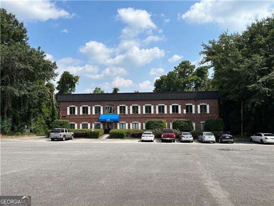 This outstanding opportunity is located approximately 1 mile East of I-75 on Hwy 120 (loop) and then 1/3 of a mile East on Hwy 120/Roswell Rd. The entire 3 story building is 3 floors of 6,060 square feet each for an 18,180 total square foot, located on a lot which is 1.306 Acres (56,889 square feet) with  40-45 parking spots . We have the following available: Terrace Level 6,060 sq feet with 2 baths remodeled for client in 2018. Main Floor, 6,060 and 2 baths which is currently in use as a medical office and could be available with proper notification for current tenant. On the upper floor there is 6,060 square feet which has recently been stripped down to a shell structure and is awaiting a new tenant or owner so the space can be demised anew to specifications agreed upon by tenant and owners. At this point it is possible to set this building up for a medium sized business who needs 18,000 square feet of space in a convenient location  in Marietta close to town, expressway and is part of East Cobb County and a short drive to downtown Atlanta.  With proper notifications, owner will assist current tenant in relocations to make the entire building and property available to buyer.  Additional photographs and floorplans can be made available to interested buyers for review.