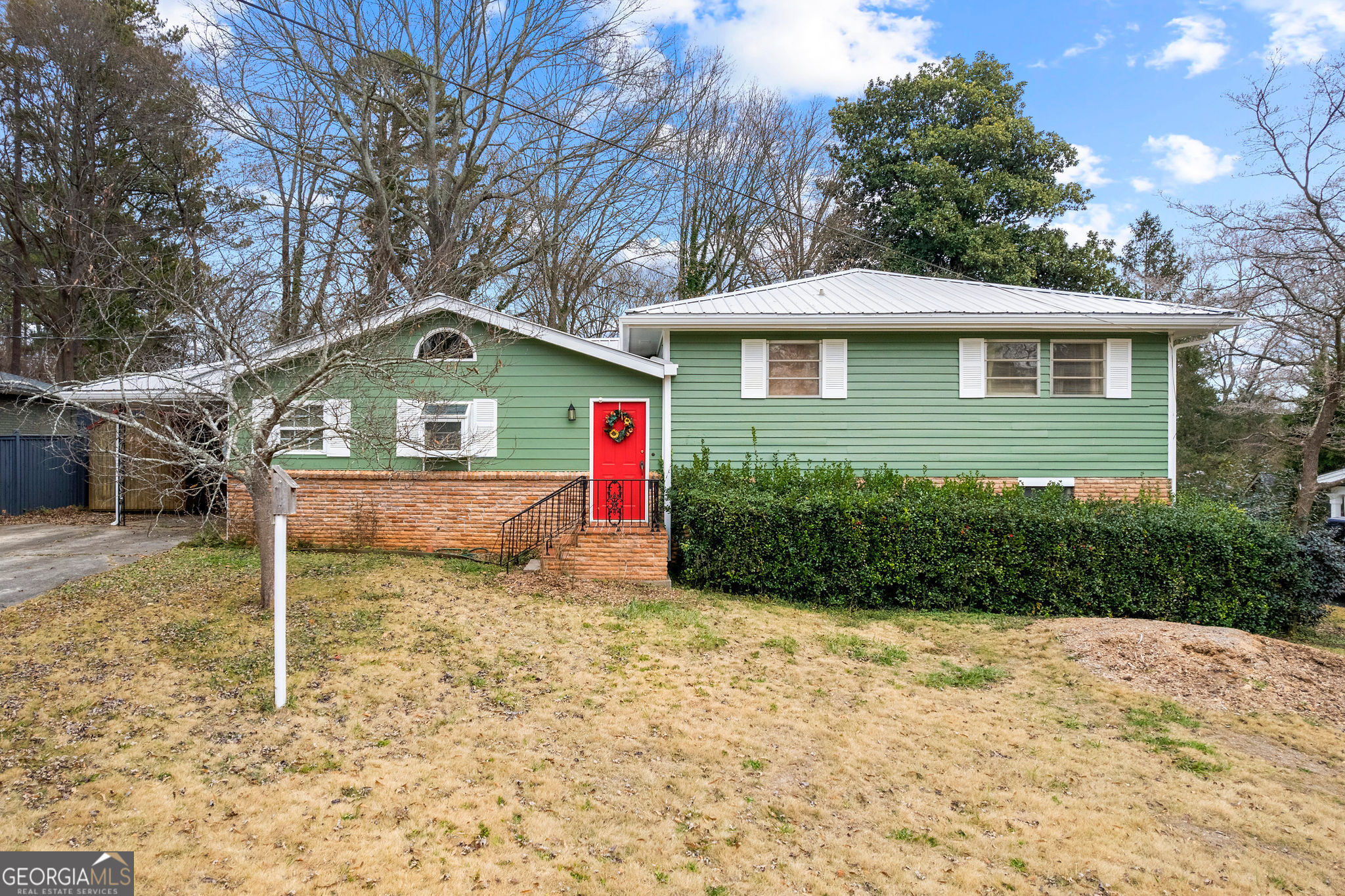 Welcome to this amazing home located in the heart of Downtown Marietta. Offering a prime location within walking distance to West Side Elementary, minutes from the Marietta Square, Kennesaw Mountain, grocery stores, and restaurants, this property combines suburban tranquility with urban accessibility. With NO HOA, the home is perfect for those seeking a blend of modern comfort and convenience. Upgrades include a durable metal roof, new electrical lines, a new furnace, and an expanded kitchen that offers both style and functionality. Gorgeous hardwood floors flow throughout the main level, adding to the home's charm. The kitchen features a breakfast nook, large kitchen island, and garden window. Upstairs, you will find the owner's suite and two additional bedrooms. The fully finished basement on the lower level is another standout feature of this home, offering a spacious and versatile living area, or it can be used as a 4th bedroom. The basement also provides access to a workshop, perfect for DIY projects or hobbyists. Upgraded sliding glass doors provide ample natural light to the family room and lead to the backyard, which provides a private space for outdoor relaxation or gardening. Equipped with an outdoor workshop and raised garden beds, this home is a rare find in Downtown Marietta. Don't miss the opportunity to own this awesome property!