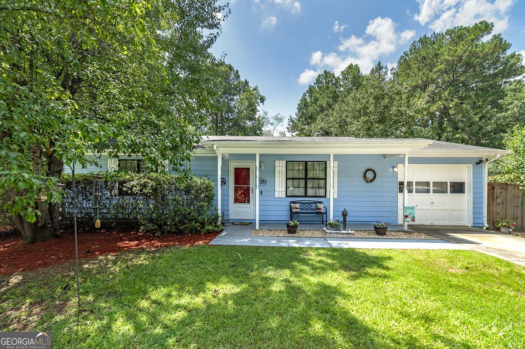 Are you looking for a well maintained RANCH home that's located in a convenient location to travel to I-75, shopping malls, restaurants and only 15 miles to the Atlanta Airport? This lovely home is just for you!! This welcoming 3 bedroom, 2 full bath home is on a large corner lot and in an established neighborhood with NO HOA. The bedrooms are spacious, the laundry room is huge & includes space for an office or large pantry, plus the garage is mostly enclosed and tied into the heat and air. My favorite place to relax would be the SCREENED IN BACK PORCH that overlooks a large, level, fenced back yard, or spend cozy evenings enjoying the firepit. This home is move in ready and just waiting for you to make your memories here. *Professional photos will be available Saturday 8/2.