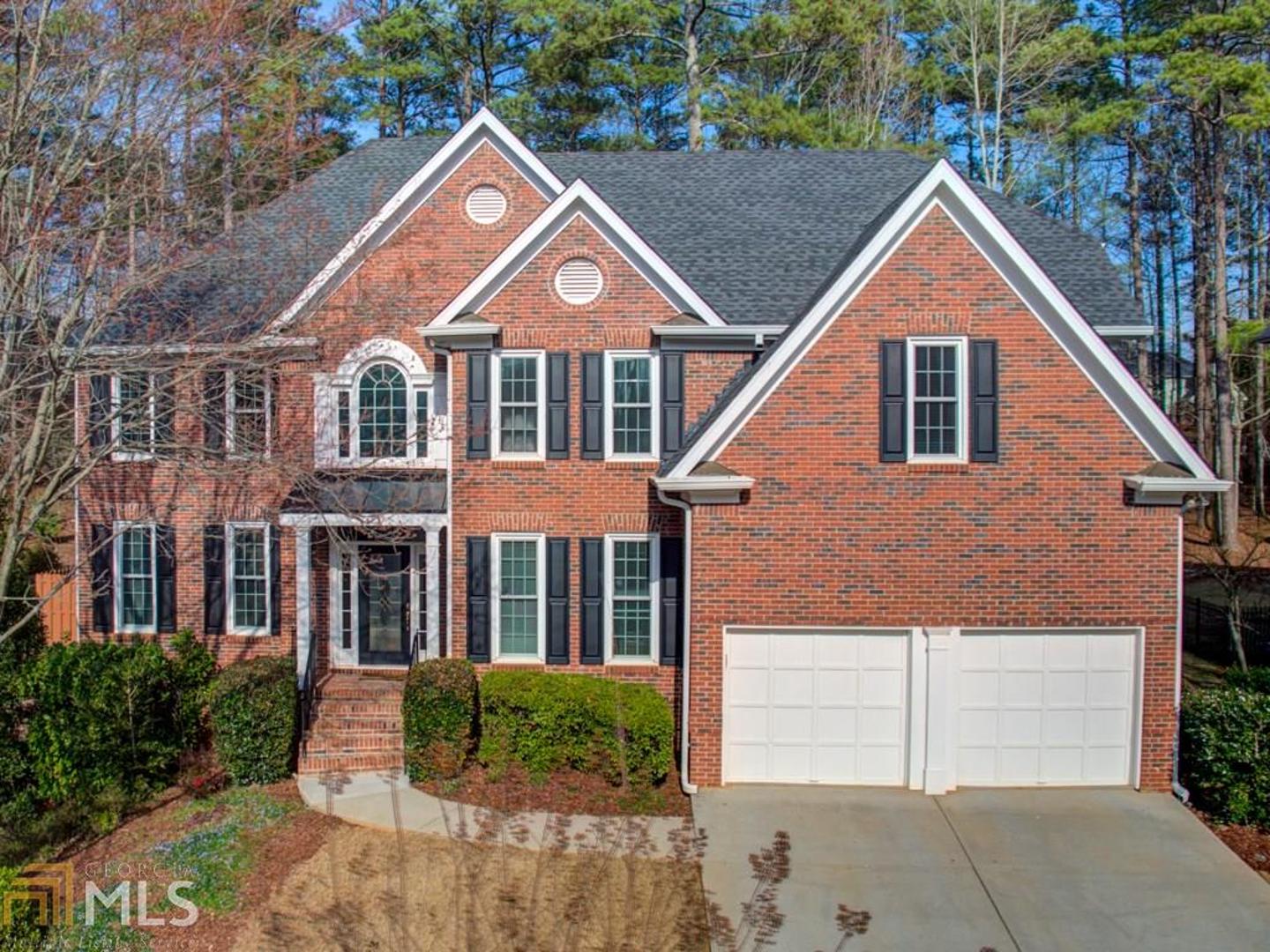 This beautiful brick home has it all! An open floor plan, custom upgrades galore, terrace level with mini kitchen, pool and professionally landscaped gardens. Designer kitchen and bathrooms boast custom cabinetry and granite along with a Master Spa Bath featuring heated floors including the shower all to make this home a pure delight! Sunlight streams into the sunroom overlooking a sparkling pool and a beautifully crafted garden. Fresh produce at your back door & a self-sustaining rain catch watering system. Top rated schools, award winning neighborhood & close to GA400