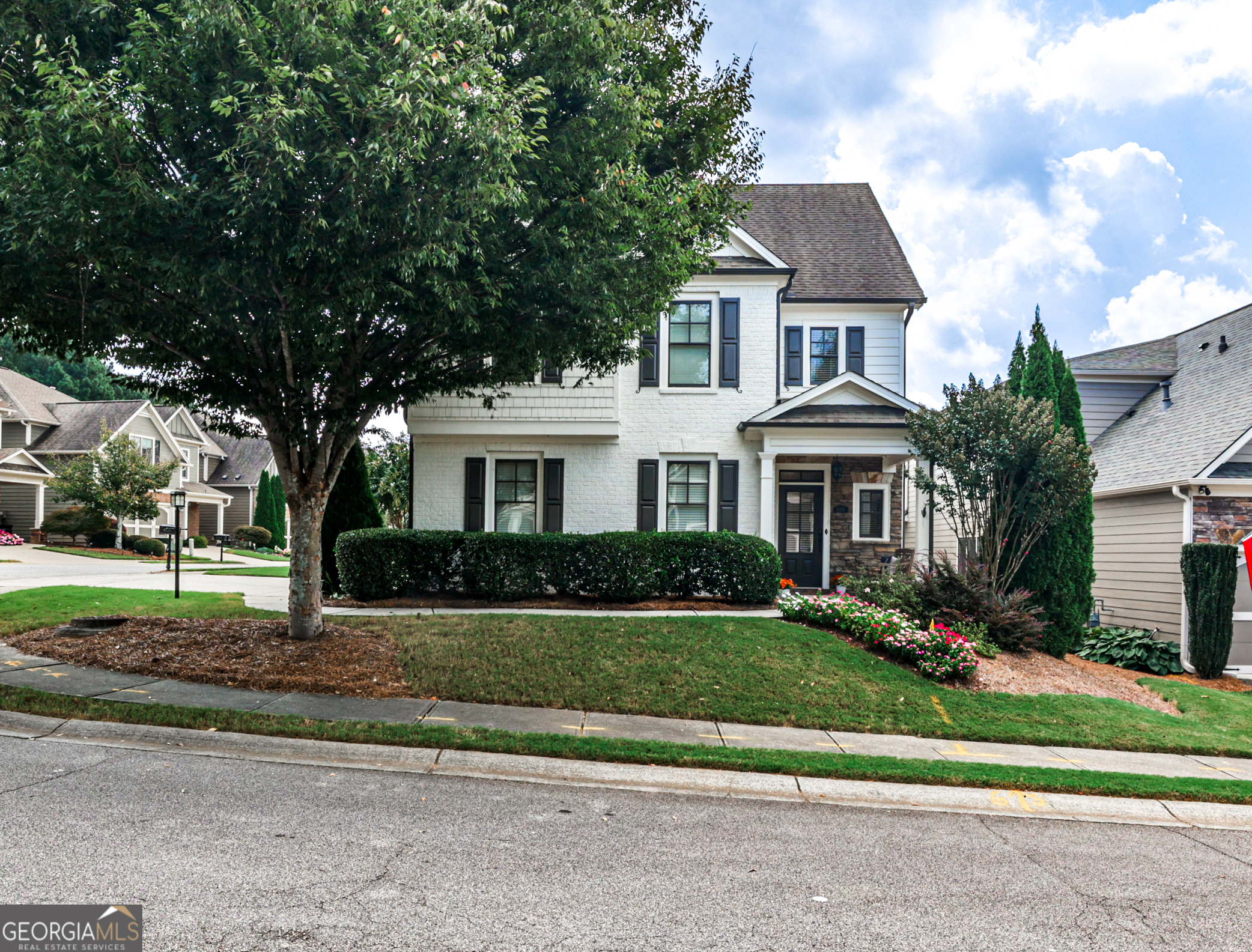 Welcome to this beautifully updated 3-bedroom, 2.5-bath home in the highly desirable Majors Mill Crossing community! This move-in ready gem features freshly painted interior and exterior, creating a crisp, modern feel throughout. Step inside to discover brand-new flooring throughout, paired with a bright, open-concept layout that's perfect for everyday living and entertaining. The fully renovated kitchen is a showstopper-featuring all-new stainless steel appliances, quartz countertops, freshly painted cabinets, a spacious pantry, and a large breakfast bar overlooking the family room with cozy fireplace and built-ins. Upstairs, you'll find a generous primary suite with a tray ceiling, double vanities, soaking tub, separate shower, and large walk-in closet. Two additional bedrooms, a full bath, and a versatile loft or home office space complete the second level. Enjoy a private, level backyard and a covered patio-perfect for relaxing or entertaining outdoors. HOA includes lawn care for easy, low-maintenance living. Neighborhood amenities include a saltwater pool, clubhouse, playground, and sidewalks throughout. Top Forsyth County schools (Shiloh Point, Piney Grove, South Forsyth HS) and just minutes from GA400, The Collection, Halcyon, and the Big Creek Greenway. This one checks every box!