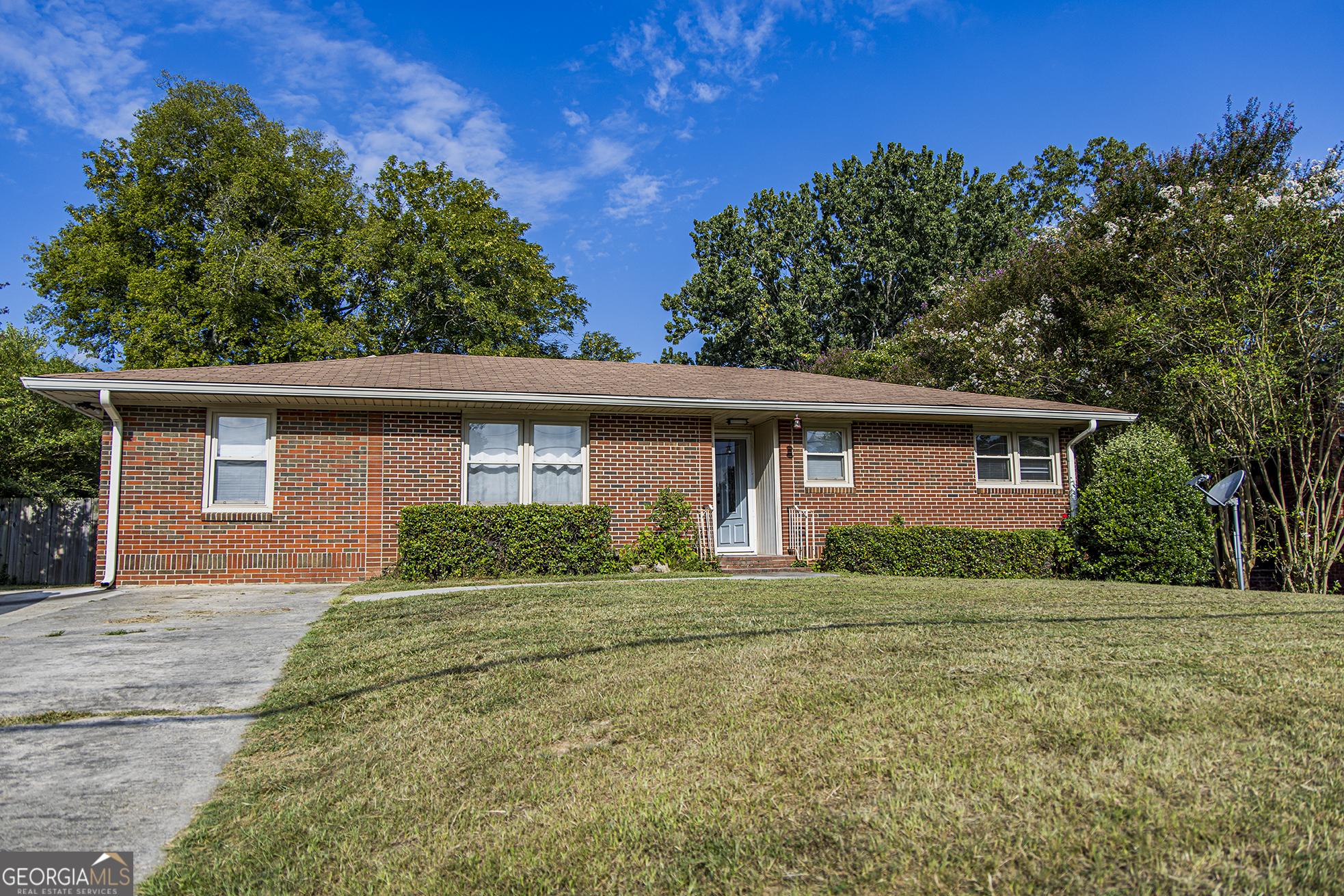 Great four sided brick home features 3 bedrooms, 1 bath, timeless hardwood floors in the living room, kitchen and all the bedrooms. Spacious den with built in cabinetry - great for storage, display or even a home office set up. The private backyard has a privacy fence great for relaxing, entertaining or pets AND an outbuilding! The sellers are in the process of replacing all the galvanized plumbing from the home to the road!!! Great home, move in ready!!!