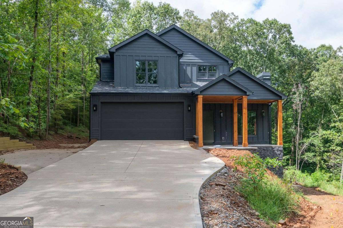 Beautiful, brand new home on almost 2 acres. Open , casual floorplan with dueling fireplaces. Beautiful , spacious, wooded homesite offers lots of privacy. Garage is 36 feet deep. Upper level laundry is spacious enough for crafts. Main level bedroom is perfect for guests, office, or someone who doesn't want to go upstairs.