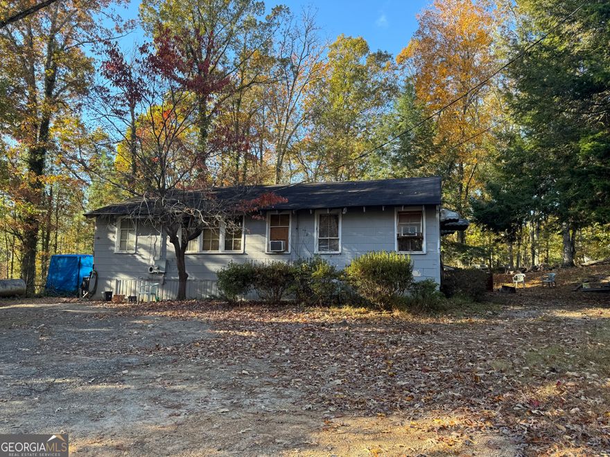 Unbeatable Gwinnett County location - just off the main road in a quiet setting. Solid structure with strong bones, ready for renovation or redevelopment. Excellent potential for commercial conversion, fix-and-flip, rental, or tear-down/rebuild. Large backyard offers expansion or new construction possibilities. Sold AS-IS