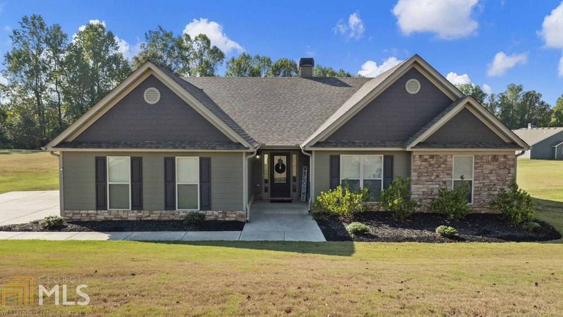 Welcome home to this beautiful stepless ranch. Open floor plan. Large granite island, perfect for entertaining. Cabinet space galore plus a walk in pantry. Breakfast area for a large table. Flex space for whatever fits your lifestyle. Would be perfect for toys, office, or dining area. Living room features beautiful stone fireplace. Hardwoods throughout main areas and all bedrooms. Nice sized secondary rms. Oversized master suite w/dble vanity and sep tub and shower. Outside you will find an expanded patio, outbuilding, and large level backyard. This home is in move-in condition - prepare to fall in love!