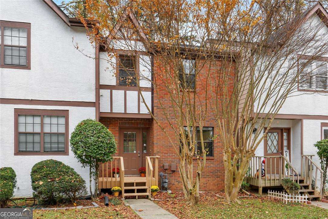 Wonderful Townhome in Great Marietta Location! One of the few 3 story, 2 bedroom, 2.5 bath townhomes in the community with optional 3rd Bedroom, Office or Flex Space in the Finished Basement. Updated Carpet, Cabinets, and Countertops. Gas cooktop and oven. Upstairs, you will find a roommate floor plan with two large bedrooms each with a private full bath. Primary bathroom has large soaking tub. In the finished basement is the space for a 3rd bedroom and an additional room for office, gym or flex space. Newer Washer & Dryer included. Newer sliding doors provide lots of natural light in the family room and lead out to a deck off the main level and patio underneath for outdoor living and entertaining. The unit is located in a cul-de-sac, overlooking a wooded area for privacy with a fenced back yard. Two parking spaces in driveway. Lawn care is included. Conveniently located near shopping, parks, and a great location for anyone working at Wellstar Cobb Hospital.