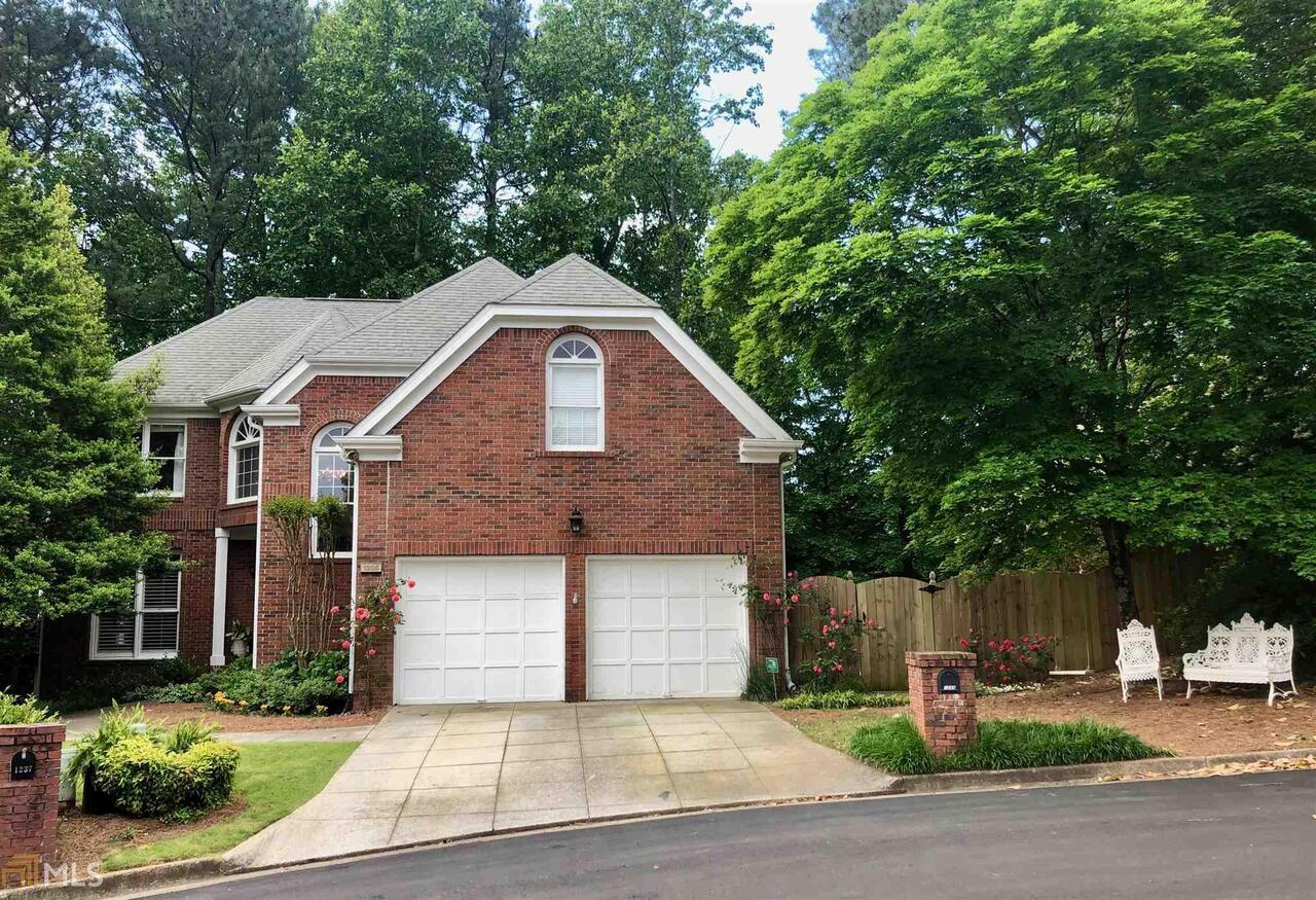 Entertainer's Dream in Austin Elementary completely renovated in 2018. Hard to find in Dunwoody: 9'+ ceilings, open floor plan, main level deck and yard, and master on the main. LIKE A BRAND NEW HOME - newer deck, roof, gutters. Three bedrooms on second level with shared sitting area and bathroom. A fully finished daylight basement with additional bedroom/office and private covered patio, one shared full bath, exercise room, storage cabinets/closets galore, oversized laundry room, and media/family room. Designer finishes in the master bath and his/her customized closet. Viking appliances, newer HVAC, neutral fresh paint, and updated landscaping. Fully fenced private yard with 500 sq ft of professionally installed faux grass which is maintenance free, pet and kid friendly. HOA fees cover yard maintenance from street to house. Live a walkable lifestyle, less than a mile, to the Dunwoody village, Nature Center and Austin Elem.