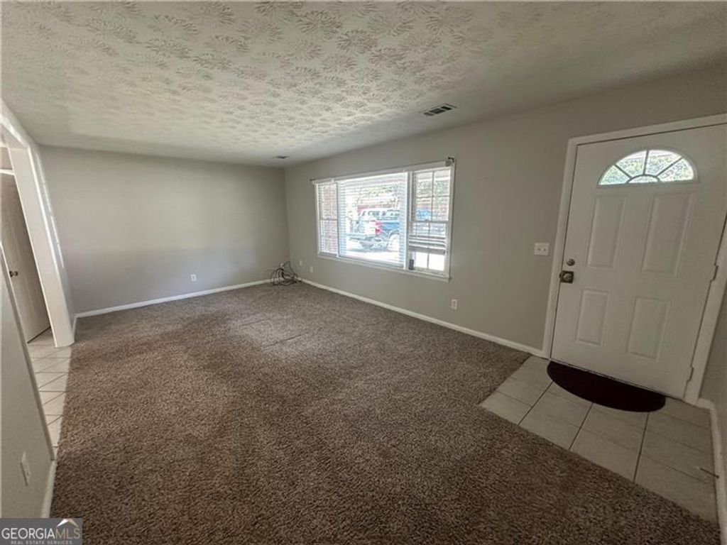 Photo of 727 S Carter Drive, Jonesboro, GA 30236 (MLS # 10624611)