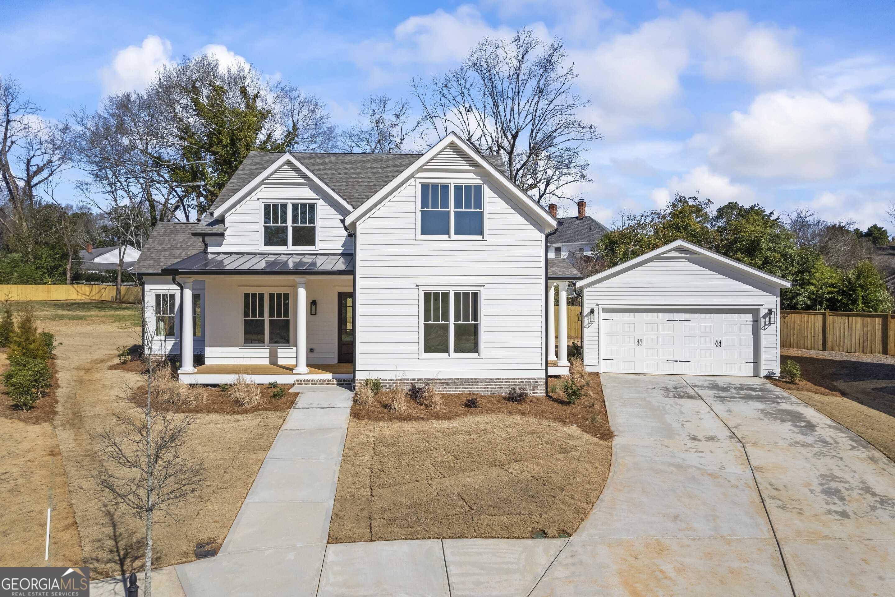 Discover this stunning new 4-bedroom, 3-bath home with a two-car garage and an oversized lot perfect for entertaining, complete with room for a pool. Designed for modern living, the open-concept layout features a spacious eat-in kitchen with a large island overlooking the inviting family room with a cozy fireplace. The primary suite is conveniently located on the main level, offering a private retreat, while the second floor boasts three additional bedrooms and a versatile loft, perfect for a second living space. Situated just seconds from historic downtown Madison, this home offers the perfect blend of charm and convenience.