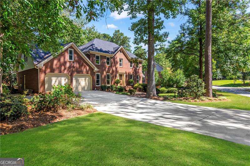 Welcome to 138 Lakeside Dr NW, where everyday living feels a little more peaceful. Nestled in the established Chastain Lakes Community with tennis courts, a pool, and its own private lake, this beautifully renovated home is the perfect blend of calm retreat and connected lifestyle. Inside, you'll find 5 bedrooms and 2.5 bathrooms timelessly renovated for today's buyers. The main level showcases freshly refinished wood flooring, while upstairs features new, durable LVP for easy, low-maintenance living. A finished basement adds even more flexibility-ideal for a media room, home gym, or playroom. The primary suite is a true retreat. Sunlight streams into the spa-like bathroom, where a natural wood vanity, soaking tub, and separate shower create a serene space to unwind. The spacious bedroom offers plenty of room to recharge, making it a cozy haven at the end of the day. Out back, the screened-in sunroom overlooks lush, mature landscaping and offers a tranquil spot for morning coffee or quiet evenings. The covered deck, stubbed for gas, is an entertainer's dream-perfect for weekend grilling and gatherings with friends. With peace-of-mind updates including a new roof, newer windows, and upgraded plumbing throughout, this home has been cared for from top to bottom. And when it's time to venture out, you'll love the convenience of being just minutes from KSU and easy access to I-75 and I-575. At 138 Lakeside Dr NW, you'll find more than a house-you'll find a home that makes every day feel easier, warmer, and more connected.