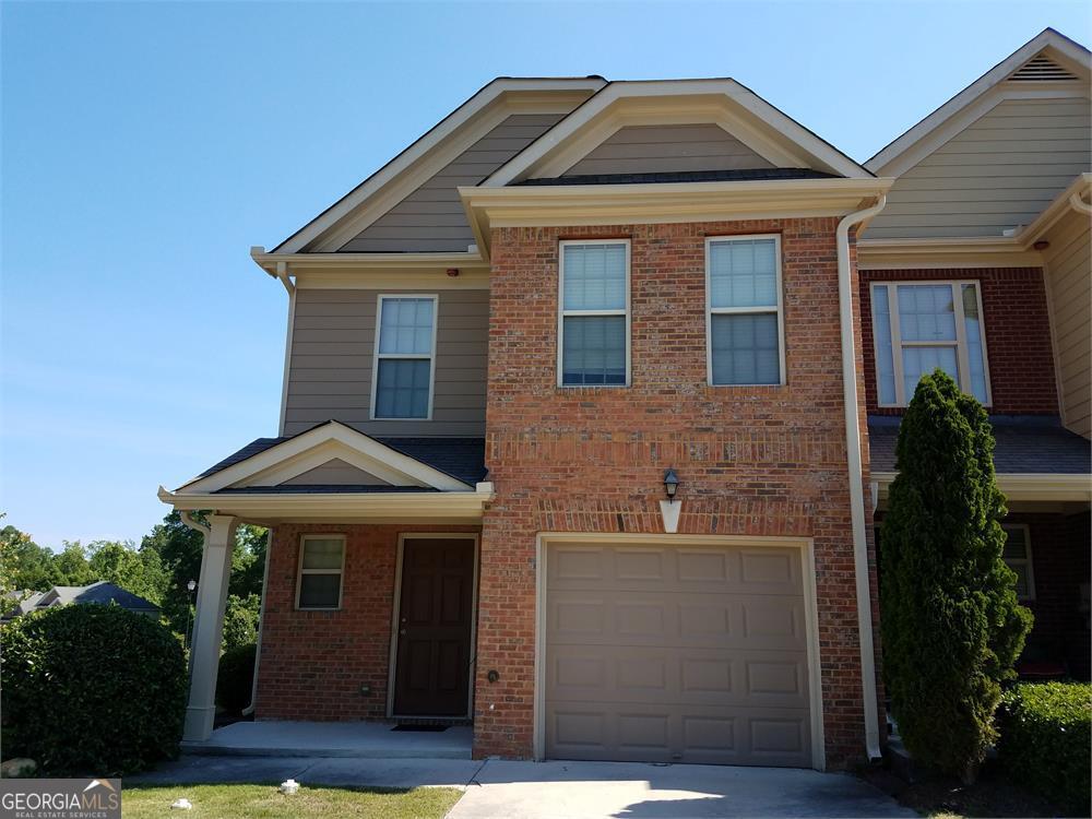 Treasure of a Townhome! This is not the average CORNER LOT townhome, it's huge with EXPANSIVE space throughout the entire interior!! This functional, open floor plan welcomes you into the first floor with wood floor foyer, half bath and coat closet while an oversized great room, gourmet kitchen that includes a kitchen island, 36' cabinets, black appliances, beautiful trim complete the lower level. There's a factory-built fireplace in the family room, a master bedroom suite with a sitting area/office, a walk-in closet, an oversize ensuite with a separate garden tub and shower, huge secondary bedrooms, and another full bath on the upper level. Convenient location 5-10 minutes from 1-20 your new home offers easy access to metro Atlanta and all of Georgia!