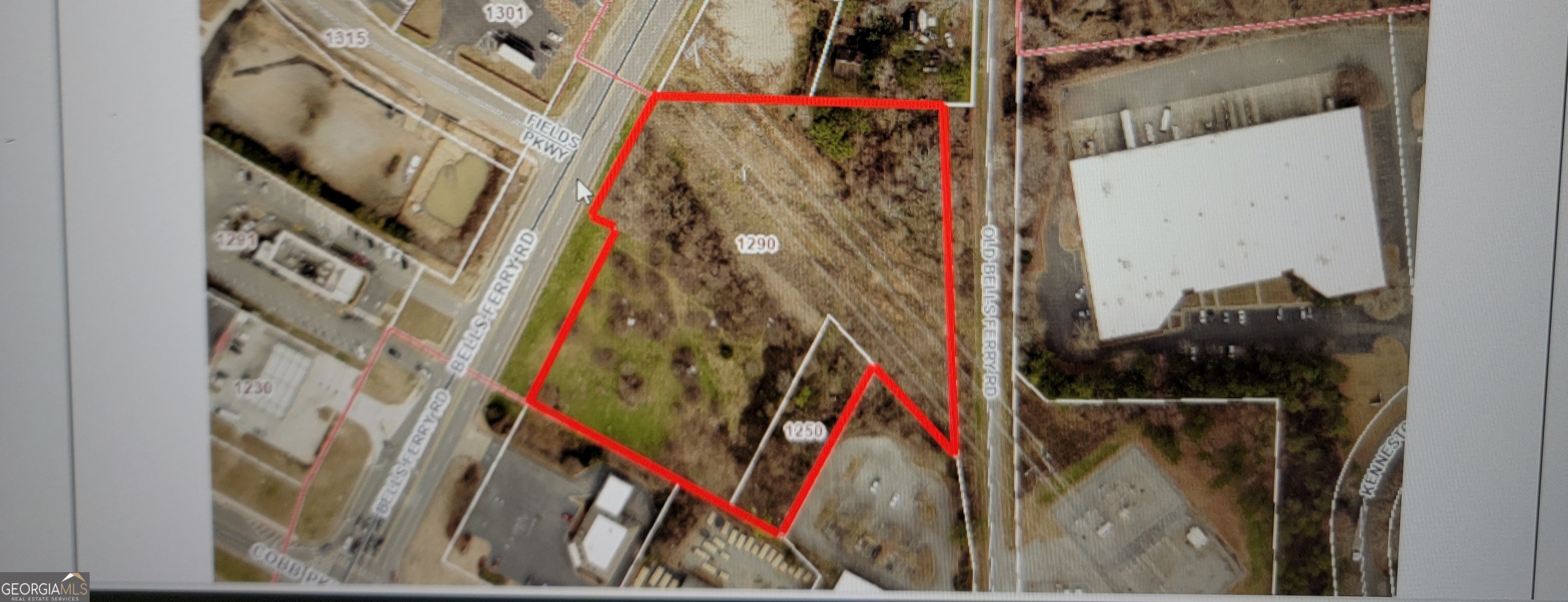 Great prime location land for developments of shopping center, warehouse, industrial, multi-units and more. Next to Ameris Bank, Across from McDonalds, and few feet away from intersection of Cobb Park way and Bells Ferry Road.