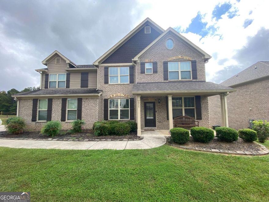 This is a rare opportunity! Welcome to 2935 Centennial Dr NE, a magnificent, like-new estate situated on a vast 0.6-acre lot in the highly sought-after, gated community of Centennial Village. Built in 2019 and spanning 3,051 square feet, this home presents an unparalleled opportunity for high-end living without the premium price tag. This spacious, 5-bedroom home is currently priced aggressively for a quick sale, offering immediate equity compared to similar homes in the exclusive Conyers area. Designed for flexible living, this stunning traditional home offers space for every need. The expansive main level showcases an open-concept floorplan with defined living, dining, and family rooms, perfect for grand entertaining or casual family gatherings. An invaluable feature for today's buyer: a full bedroom and bathroom suite located on the main level! This is ideal for a private in-law suite, guest accommodations, or a highly coveted primary office. Upstairs, the luxury continues with four generous bedrooms, including a superb owner's suite that provides a true private sanctuary. Step outside to your private oasis, complete with a charming sitting porch and patio, all within the secure confines of the gated community. Enjoy the perks of a Golfer's Dream! The community is situated nearby the Cherokee Run Golf Club, an Arnold Palmer-designed championship course, and is just over a mile from the Georgia International Horse Park, offering world-class events, miles of scenic trails, and expansive parkland. Schedule your private tour today-this opportunity will not last!