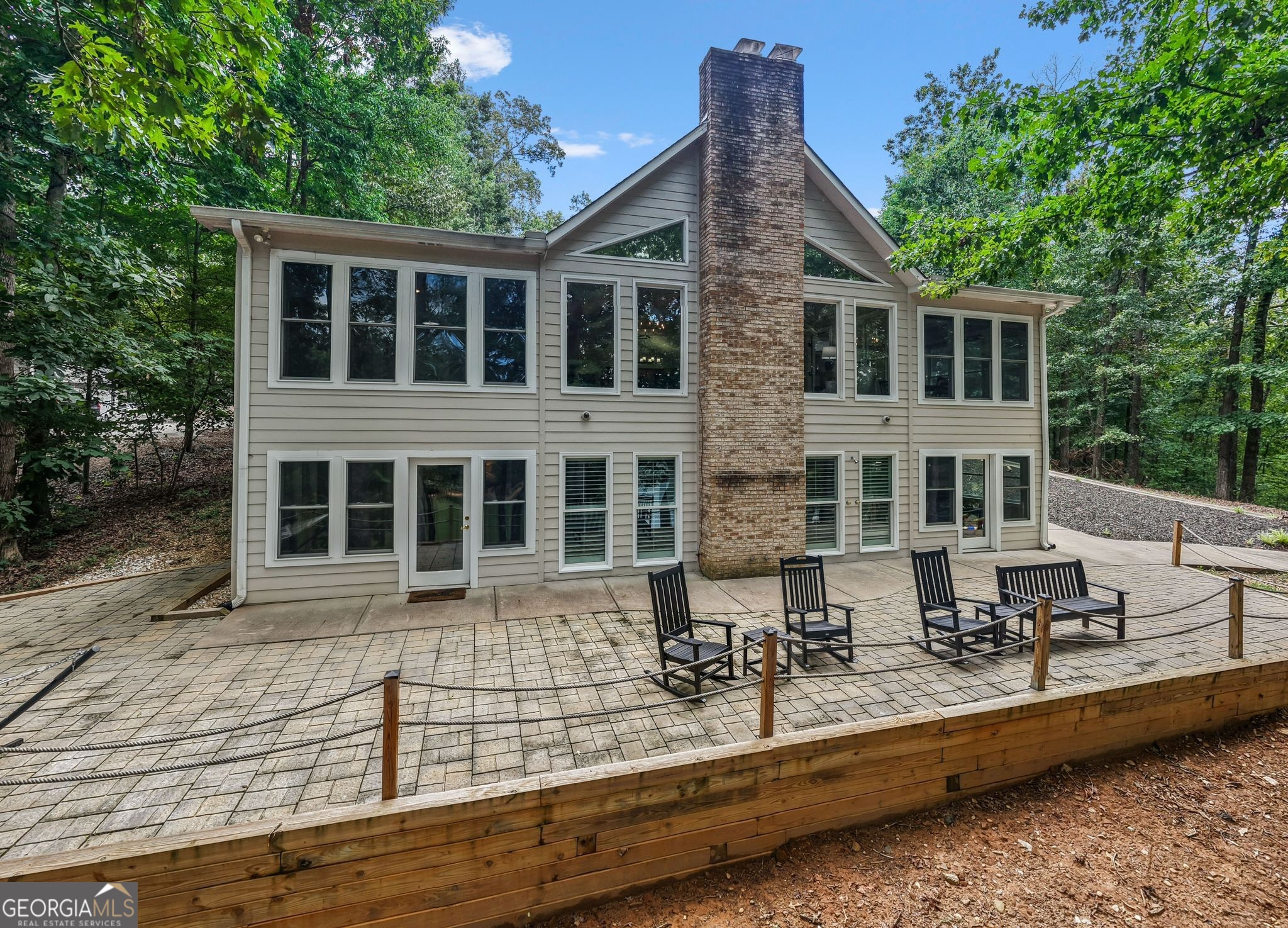 Expansive Lake Hartwell Estate with Gated Entry & Versatile Guest Spaces Behind a private gated entry, this remarkable Lake Hartwell property offers 7 bedrooms, 3.5 baths, and exceptional flexibility for both living and entertaining. Thoughtfully designed for gathering, the home boasts open-concept living spaces, abundant natural light, and inviting views of the surrounding landscape. A rare highlight is the extra-large detached workshop, complete with a half bath and the option to finish an upstairs apartment - ideal for guest quarters, or a private studio. With multiple garage bays and generous storage, it's perfectly suited for lake toys, hobbies, or a home office. Located on the Georgia side of Lake Hartwell, this property blends the ease of lake life with the comforts of a well-appointed retreat. Whether you envision a full-time residence, a family getaway, this estate delivers it all - in style.