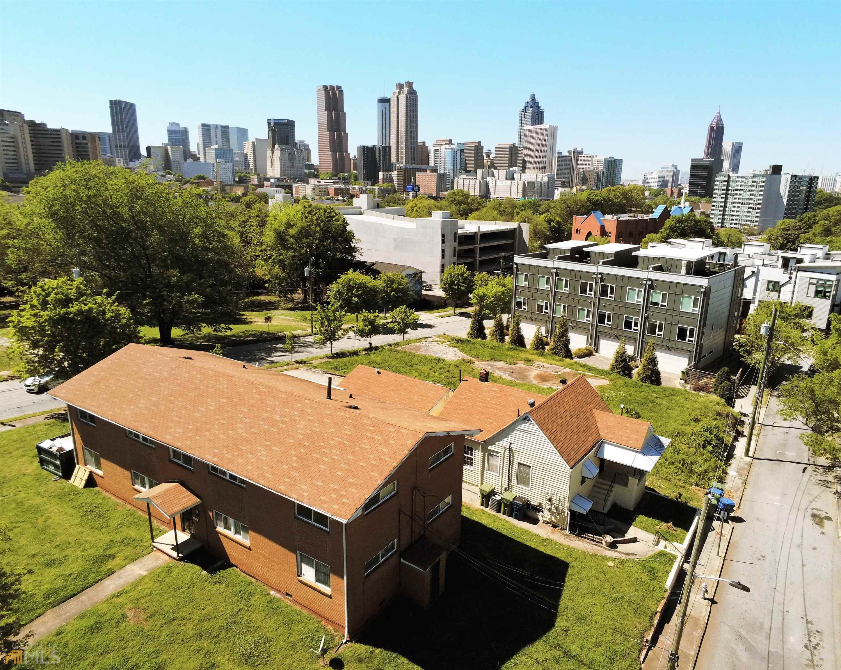 LOCATION, LOCATION LOCATION!!!! THREE TOTAL PARCELS ARE INCLUDED IN THIS SALE! Don't miss you opportunity to own this Multi-Family Cluster located in the THE HISTORIC OLD FOURTH WARD!!! The properties included in the sale are a Quadruplex, Triplex & An extra parcel of Land. All of the properties are located on a huge corner lot with an Amazing view of the Atlanta City Skyline! 4 out of the 7 Units have been renovated. with New Flooring, New Kitchen Granite Counter-Tops & New White Cabinetry, Backsplash & Fixtures. All New Updated Baths, Tile & Vanities. Incredible Income Potential for an Investor looking to expand their portfolio. The properties are walking distance from Auburn Avenue, Restaurants/Bars, Historical Landmarks such as MLK National Park & The King Center. Located just a half of a mile away from Georgia State University, Minutes from Downtown Atlanta, Mercedes Benz Stadium & More! The address of the duplex is 87 Lucy Street located right next to the Quadruplex. All Tenants have already been vacated for a Fresh Start! Rental Comps are incredible in the Growing Area! Don't miss your opportunity to invest in Atlanta in a Major Way