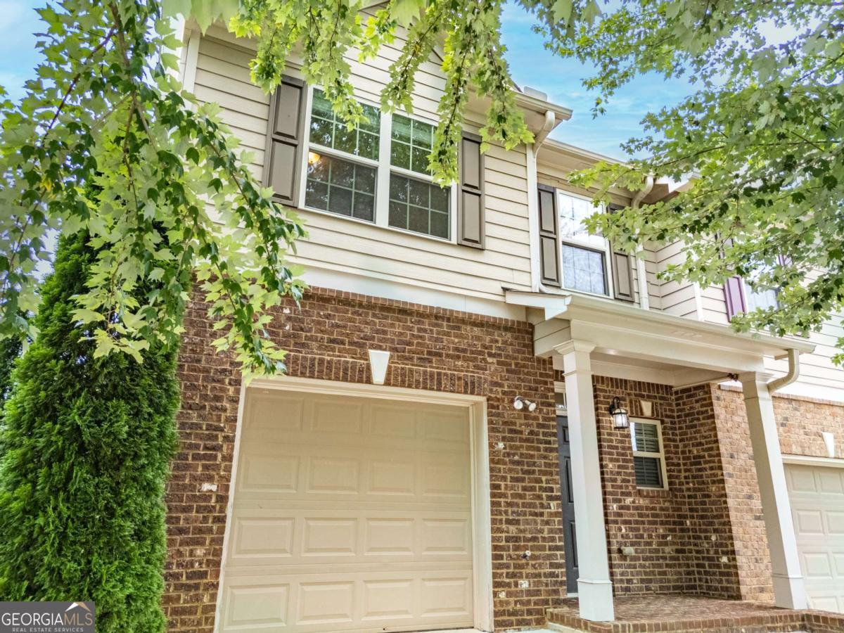 You don't want to miss this beautiful end-unit townhome featuring 3 bedrooms and 2.5 bathrooms! This home offers a spacious open-concept layout with stainless steel appliances and a large island in the chef's kitchen overlooking the dining and living areas. Gorgeous hardwood flooring runs throughout the main level, with plush carpet upstairs. The oversized owner's suite includes elegant tray ceilings. Located in a great school district with easy access to I-85 and just minutes from the Mall of Georgia. Water has been turned off due to safety concerns.