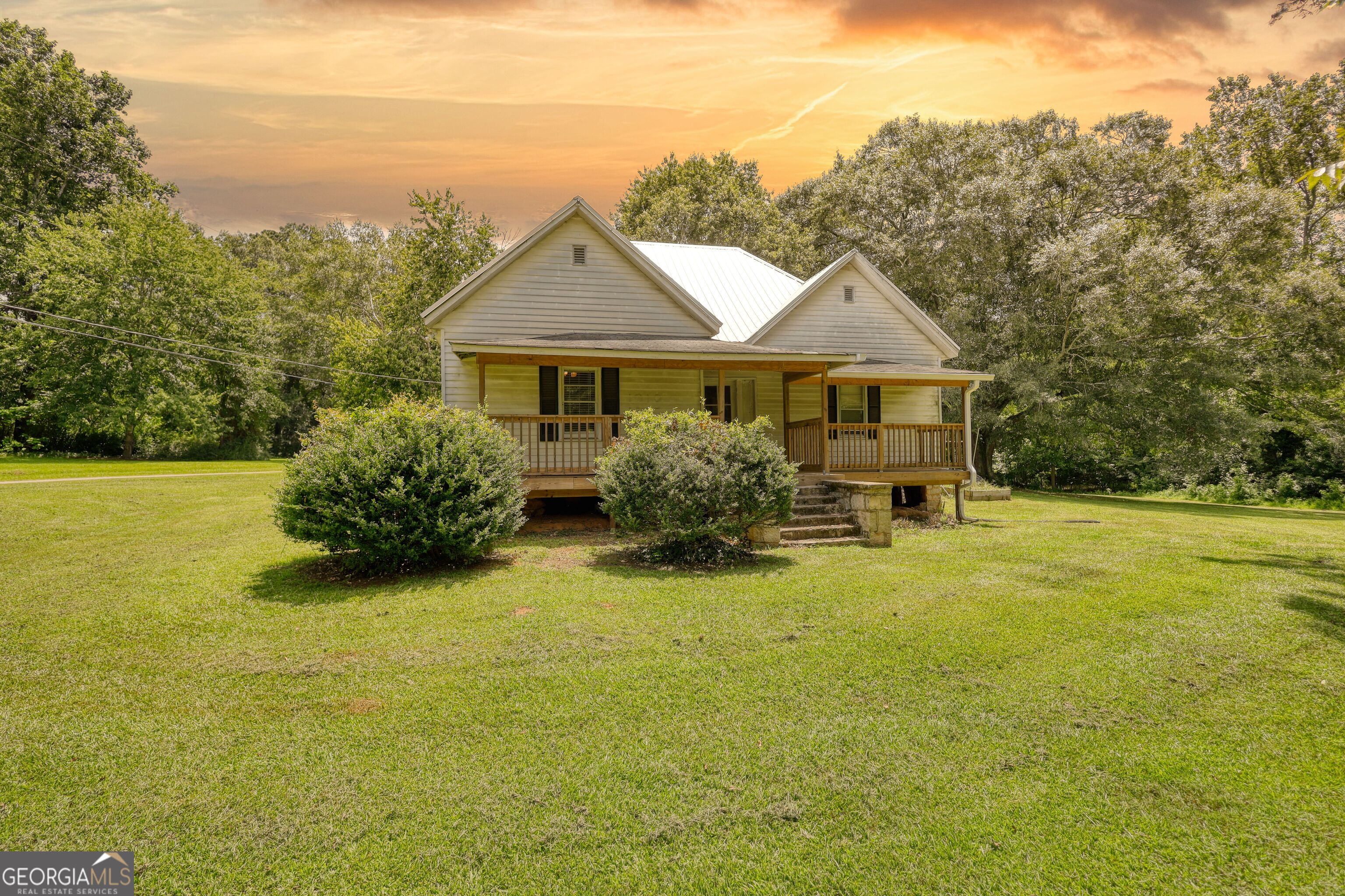 Step back in time with this charming circa 1935 farmhouse, perfectly situated on over one acre of picturesque land brimming with mature trees and a pond view. This 3-bedroom, 2-bathroom home features some of the original hardwood floors and decorative-only original fireplaces. The interior has been thoughtfully updated to enhance comfort and efficiency with a spacious eat-in kitchen and all the modern conveniences. While some exterior repairs are needed, the home maintains its classic farmhouse character and offers endless possibilities. Whether you're relaxing on the front porch, gardening in the backyard, or enjoying the peaceful pond view, this property offers plenty of space to roam and unwind. RARE BONUS OPPORTUNITY: the adjacent property on the same shared driveway is also listed for sale offering the chance for multigenerational living and homesteading! Don't wait - schedule your tour today to experience the best of rural living with all the modern comforts!