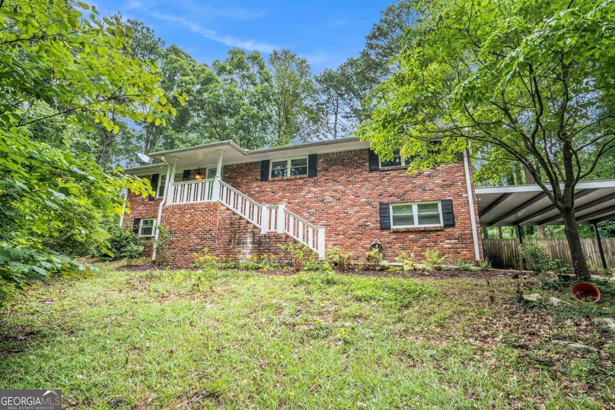 Welcome home to your wonderfully appointed 4 sided brick ranch with a full finished basement all situated on 2 acres! This home has it all! Sand and finish red oak flooring thruout the main level is sure to impress and the open concept floorplan is great for entertaining guests or easy family living. The beautifully updated kitchen has stainless steel appliances, granite countertops, a breakfast bar, and custom cabinetry. Enjoy dining in style as the dining room is adorned with a solid masonry fireplace, elevated hearth, and wood beam mantle piece. Your oversized 4 seasons sunroom is a wonderful retreat overlooking the deck and private backyard oasis. The primary bedroom with an updated full bathroom, 2 additional guest bedrooms, and another updated full bath complete the main level. Your terrace level has a large den, gym/exercise/game room, a bar area, another bedroom, a full bath, a laundry room, and a garage. Hurry! You do not want to miss out on this very rare opportunity!