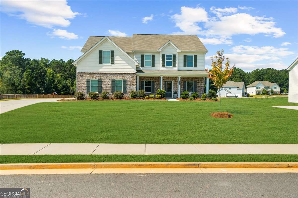 Beautiful 5-bedroom, 3-bath home in Monroe, GA! This like-new home offers a full bedroom and bath on the main level, luxury laminate flooring throughout, and a spacious office perfect for remote work. Upstairs, you'll find the primary suite with a private bath, plus 3 additional bedrooms and another full bath. The large backyard offers plenty of space for outdoor fun. A perfect family home with room to grow! Sellers are offering a $5,000 credit towards closing cost or buy down!