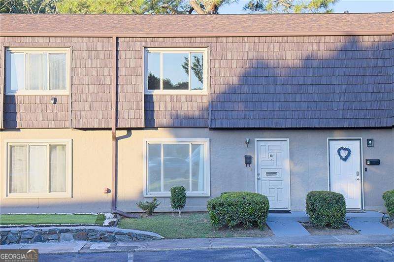 3/2 Buydown Available - Lower Interest Rate, Higher Happiness Looking for a home that won't drain your energy or your wallet? Say hello to this adorable, updated, and energy-efficient townhome that comes with a rare 3/2 buydown offer through our preferred lender. That's real savings-like "treat-yourself-to-weekly-brunch" savings! This 2-bedroom, 1.5-bath beauty brings the vibes and the value. From the moment you walk in, you'll notice the fresh LVP flooring throughout-yes, even upstairs! That's right, not a single piece of carpet in sight. Your socks will thank you. The home is filled with natural light thanks to new privacy-enhanced windows (let the sunshine in, but keep the neighbors out), and the brand-new high-efficiency HVAC system means you can stay cool in the summer, cozy in the winter. Now let's talk about the perks-because this HOA is working overtime. They cover water, gas, sewer, trash, exterior maintenance, pest control, and toss in access to a pool, tennis courts, and even a dog park. You literally don't have to lift a finger outside unless it's waving at your neighbor on the way to the pool, which is right at your doorstep across the parking spots. Location? It's a winner. Just minutes from Life University, Kennesaw State, The Battery, and all the shopping, dining, and highway access your heart could desire. Inside, the dining room opens right onto your own private, newly fenced backyard-ideal for morning coffee, grilling with friends, or letting your dog live their best life. The kitchen has plenty of white cabinets, and the oversized laundry room is begging to be your new catch-all for extra storage. Upstairs, both bedrooms are spacious with large walk-in closets that can handle all your "I might wear this again" clothes. The full bathroom is perfectly placed between them, making mornings just a little bit less chaotic. With a recent price adjustment and a fantastic lender incentive, this townhome is a total no-brainer. So go ahead-fall in love, save money, and move in. Tour it today before someone else swipes right on it first!