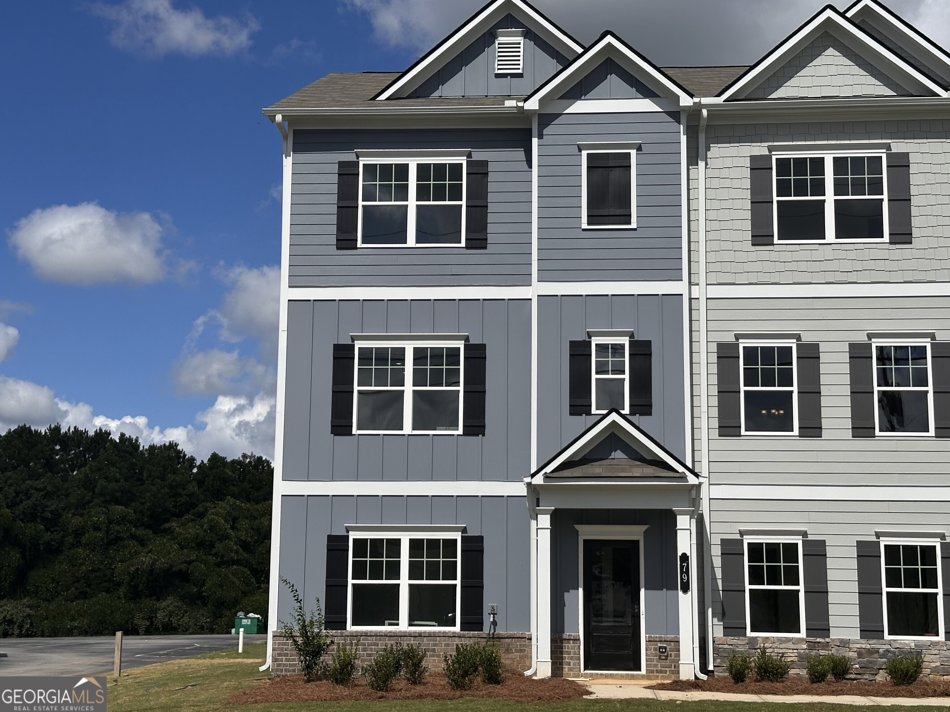 Move in Ready August! The Radcliffe townhome plan, located in Smith Douglas Homes Sterling at The Villages. This 4BR/3.5BA end unit townhome features a modern design with ample windows and a rear entry garage. The first floor flex space is an ensuite fourth bedroom ideal for guests. On the second floor, the main living area boasts an open-concept layout, including a family room with a modern linear fireplace at the front of the home, an island kitchen, and a dining area that provides access to the deck. Upstairs, the primary suite is situated at the rear of the home for added privacy, separate from the other two bedroom and includes a spacious walk-in closet, tiled shower and tray ceiling. All floors have 9ft ceiling heights. Seller incentives with the use of our preferred lender. Some Photos are not of actual home and some are representative of plan.