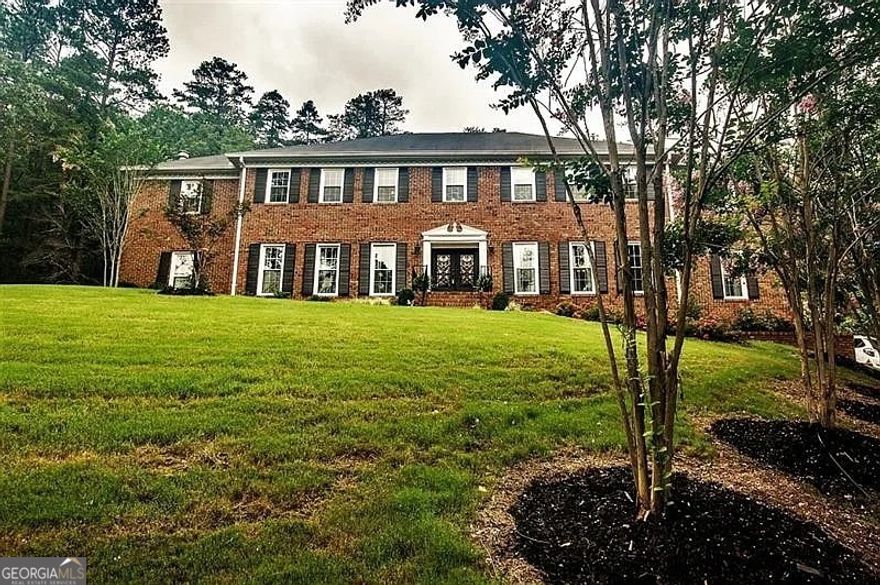 Looking for land and privacy without leaving the city? This classic brick home is nestled at the edge of the Marshall Forest, offering serenity, seclusion, and convenience. A long, winding gated driveway leads you to your own private retreat.    Inside, you'll find 6 spacious bedrooms - possibly up to 8, with two primary suites (one on each level). Need flexibility? There's a large workout room and a study upstairs that can easily serve as additional bedrooms or bonus rooms.    The updated kitchen features all the modern upgrades you expect, and all bathrooms have been stylishly refreshed. Entertain with ease in the huge separate dining room, a formal living room (or potential office), and a precious breakfast nook with peaceful views of the forest.    Enjoy outdoor living on the new oversized deck or relax year-round in the sun room with a hot tub.    With space to grow and gather, this is a home built for lasting memories - whether you're expanding your family or simply seeking a private haven in town.