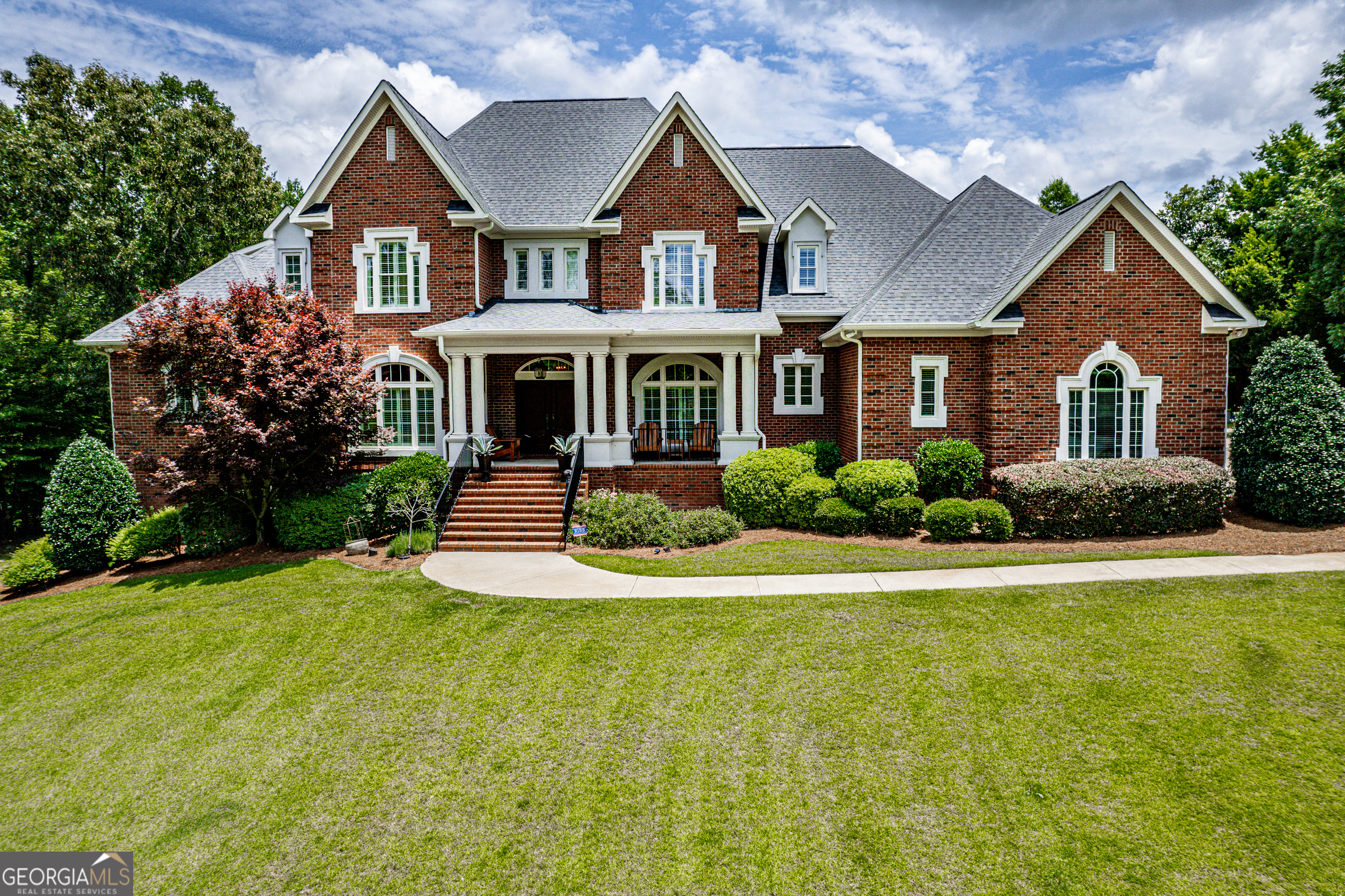 Stunning All-Brick Estate in Irongate - Introducing this exceptional 5-bedroom, 4.5-bathroom home located in the highly sought-after Irongate neighborhood in South Monroe County. From the moment you enter the impressive foyer with elegant tile flooring and a barrel tongue-and-groove ceiling, you'll be captivated by the craftsmanship and attention to detail throughout. The spacious formal dining room and grand great room offer the perfect setting for entertaining, while the centrally located kitchen opens seamlessly into a large keeping room featuring custom built-ins and a beautiful fireplace-ideal for everyday living. The luxurious primary suite is a true retreat, boasting a spa-like bath, a custom-designed walk-in closet, and an adjoining office with built-ins. A private guest suite is also located on the main level, perfect for visitors or multigenerational living. Upstairs, you'll find two additional bedrooms, a versatile bonus room, and a dedicated exercise room-offering space and flexibility for the whole family. Unfinished basement area offers ample space for storage. Outside offers your own private paradise. The screened porch with fireplace overlooks a resort-style backyard featuring a sparkling gunite pool with spa, a lush, private landscape, and a covered cook shed perfect for outdoor gatherings. Situated on 5.3 private acres. All of this is just minutes from Zebulon Road, offering easy access to shopping, dining, and I-475.