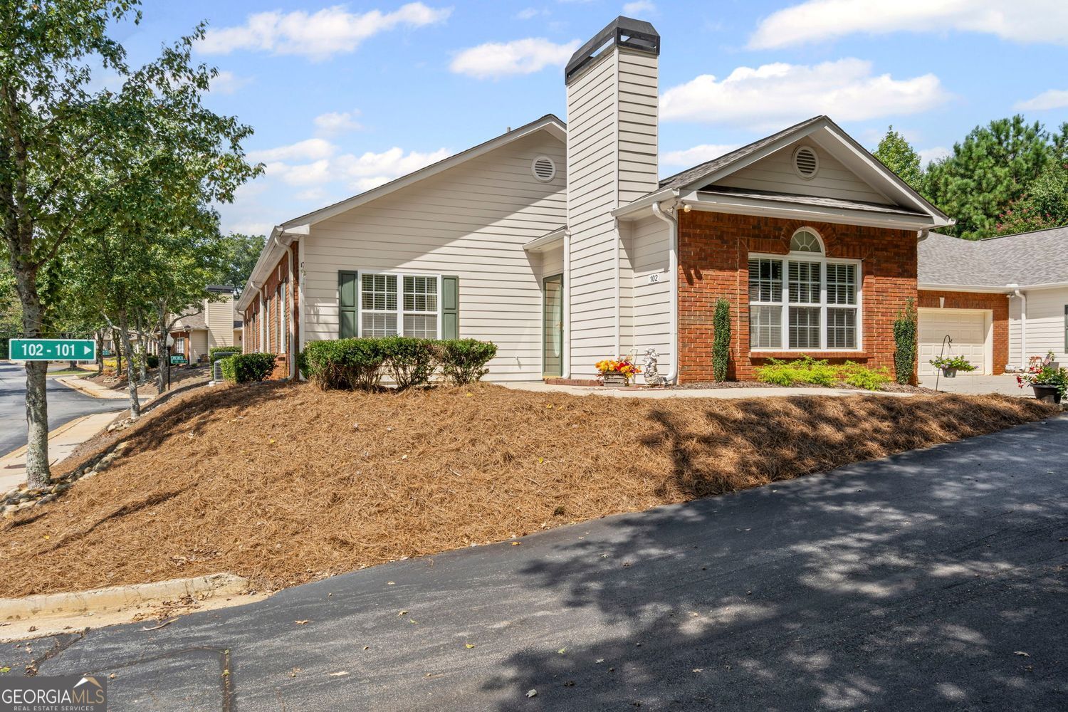 Garden condo located just outside of downtown Cumming in a quiet gated community for 55+. Single level living at its finest with friendly neighbors and handicap accessible. This unit has 2 bedrooms, 2 full bathrooms, including living, dining and kitchen with laundry room. The exterior has an open front porch/patio area and a large attached 2-car garage. The unit had the roof replaced in 2018, HVAC/Furnace system replaced in 2021, new water heater January 2025, updated carpet and LVP flooring, interior paint and updated bathroom fixtures. Like new washer and dryer stay with the unit. The unit is located just around the corner from the Cumming City Center, approximately 1/2 mile from County Fair Grounds, library, post office, police station and North Side Forsyth Hospital. HOA amenities include; pool, clubhouse and fees include all exterior maintenance, lawn care, trash pickup, water and sewer. Forsyth County offers senior exemption on property taxes. No rental units allowed. All owner occupied.