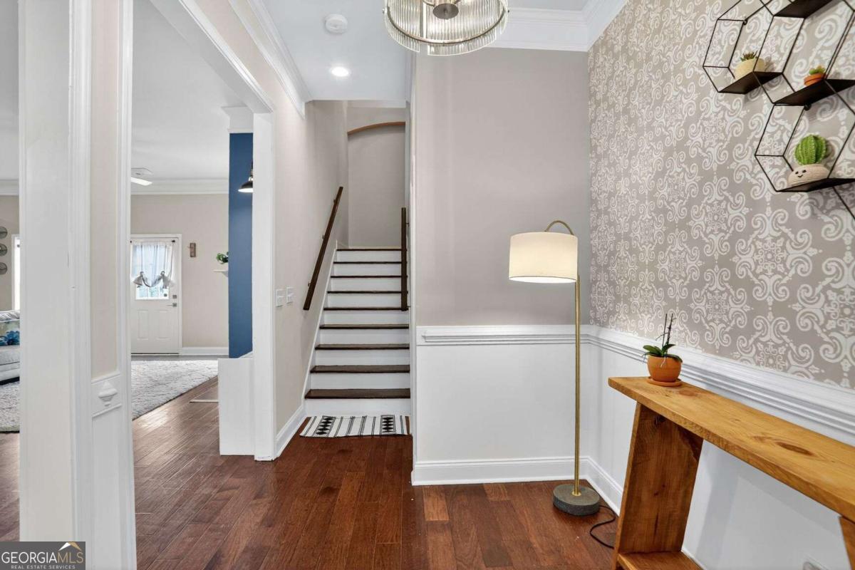 If you enjoy sitting on the front porch sipping on ice tea or the beverage of your choice and looking over the community park, patio and BBQ grilled, you might just be the buyer for this well built, barely lived in craftsman style home with all the bells and whistles. It is almost NEW, only 6 years new. Step inside the open entry foyer. Take in the open dining room displaying coffer ceilings & lots of windows. Be sure to observe the warm and spacious family room with a fireplace, a special room for family gatherings. This room opens up to the kitchen which demands attention with its large granite island that seats four comfortably. A great place to have breakfast, lunch or dinner. The kitchen boosting with beautiful white cabinets, a gas stove and a walk-in pantry! If you like to stock up, storage will not be a problem here. All of the stainless-steel appliances and smart locks, security and thermostat will remain with the property. Upstairs features a primary oversized bedroom with a lot of natural lightings. The primary bathroom sparkles with marble floors, dual vanities, a soaking tub and a separate shower. There are also dual closets featured in this room. The secondary bedrooms are roomy and share a full bathroom with dual vanities. The washer and dryer are located on this 2nd floor adjacent to the bedrooms. They will remain with the property. Don't wait, request showings now.