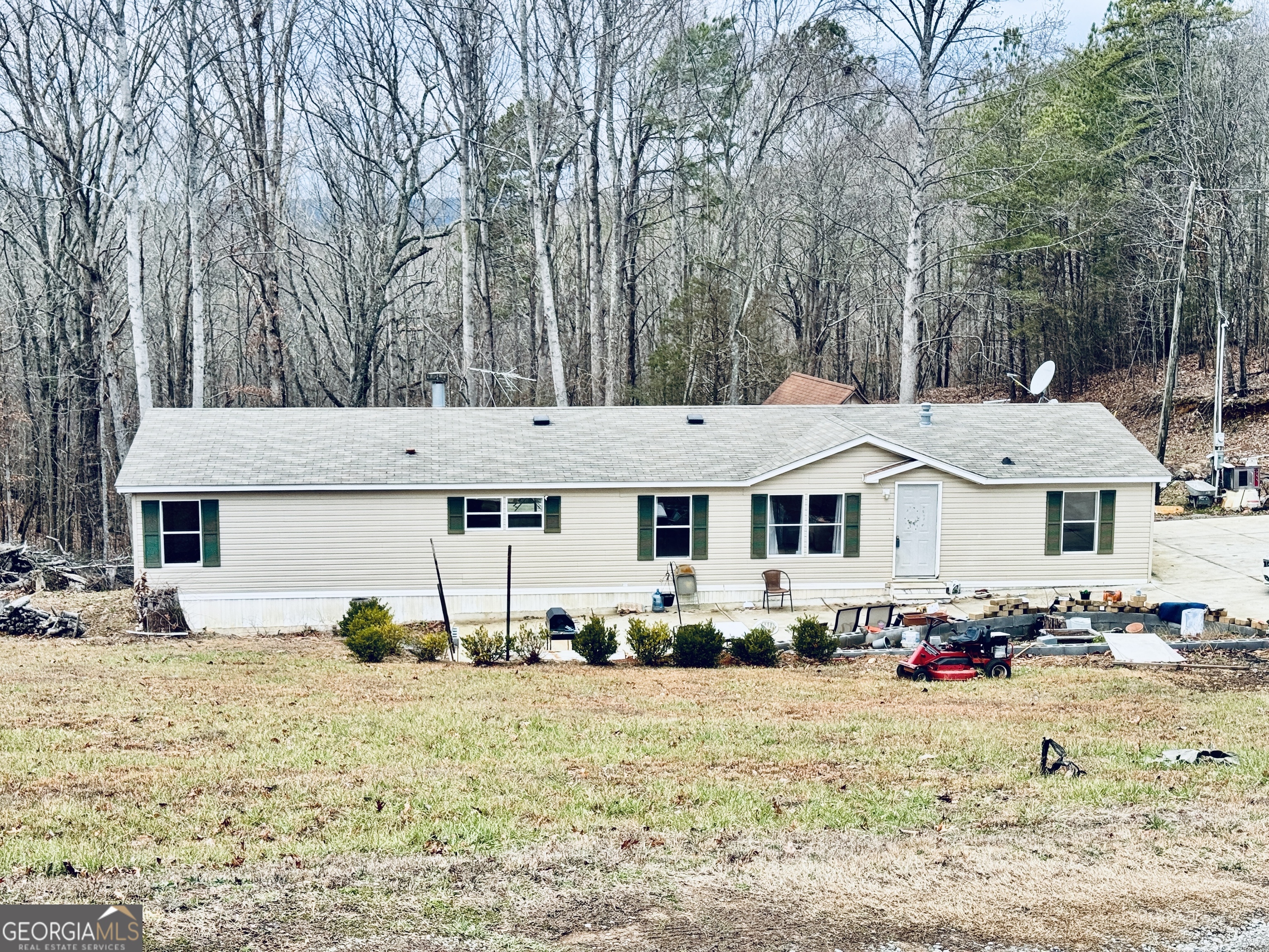Welcome Home! Call or Text me Today to see this Well Maintained roomy 5 Bed 2 Bath Home on 5 acres with no HOA in Canton. Open floor plane with upgraded kitchen with granite countertops. Roomy secondary bedrooms, ample closet space and upgraded bathrooms and kitchen. Fireplace to keep you cozy and warn on those GA winter nights. Master bath features a jetted tub and tlied shower. Spacious Laundry/Mud room. Off of the kitchen there is a deck to the functional backyard which would be perfect for entertaining. Close to shopping, dining entertainment and the Mills of Etowah.