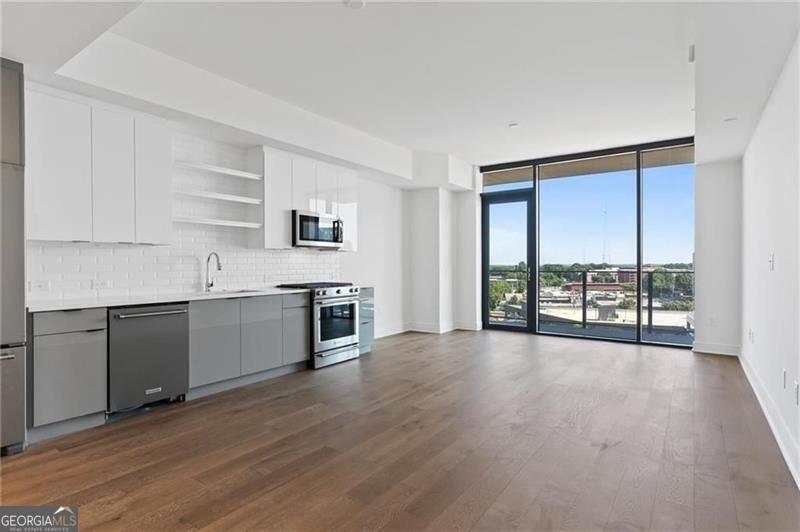Seven88 West Midtown is a high-rise condominium building located in West Midtown. A fantastic studio with floor-to-ceiling windows. The unit comes equipped with Stainless Steel Appliances, including a Refrigerator and Full-Size Washer/Dryer. Quartz Countertops and Engineered Hardwood Flooring Throughout. Frameless glass shower. Secure Access with 24/7 Concierge. Resort-style amenities include a Fitness Center, Outdoor Grilling Areas, heated saltwater pool, whirlpool spa, clubroom with billiards and lounge, shuffleboard, and plenty of TVs. We also welcome your fur babies with an indoor dog park and spa. Walking distance to the retail and restaurants. Minutes from the Beltline trail and new Westside Park.