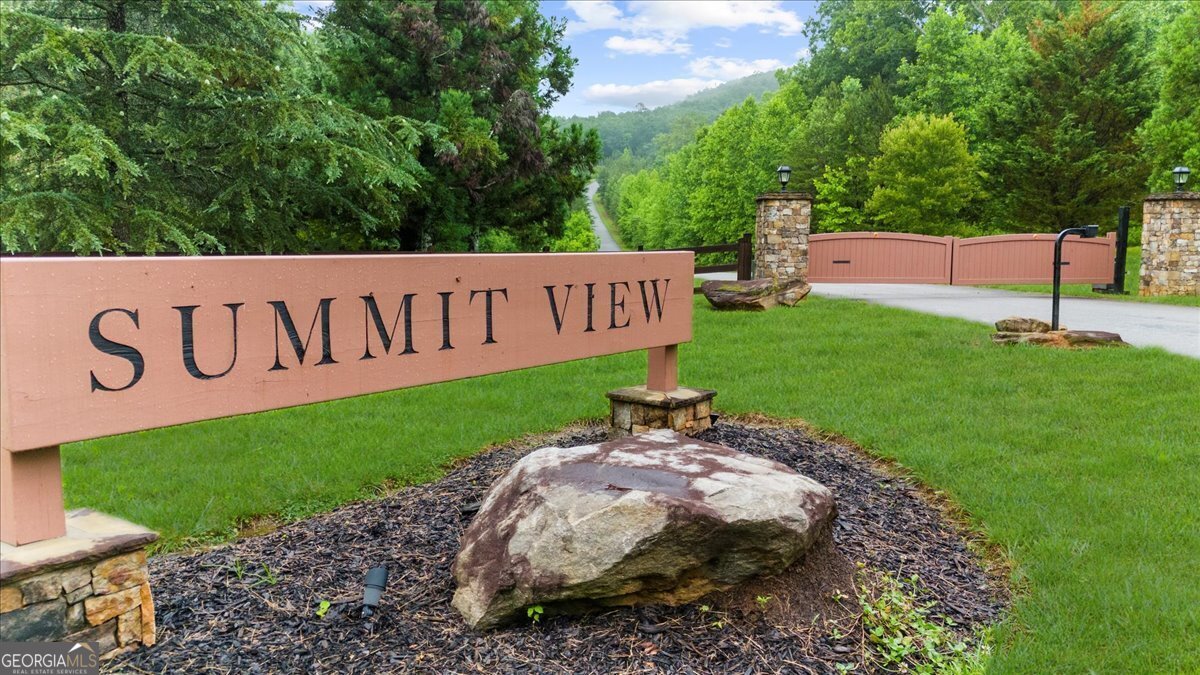 5+ acre lot with incredible long range mountain views. Located within Summit View Subdivision, this is a great buildable lot. Common area at the top of the community offers additional mountain views, pavilion, picnic area, grills, and large stone fire pit. Gated community has underground utilities and paved roads. Located perfectly in the Northeast Georgia Mountains with convenient access to hiking trails, premiere lakes & rivers, and world renowned trout fishing. Bring your plans & build your dream home!
