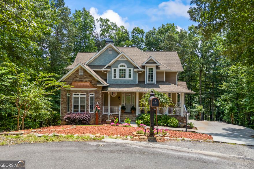 Golf Course Living Meets Mountain Luxury in Helen, GA! Welcome to your dream mountain escape in the gated Innsbruck Golf Community of Helen, GA. Situated on an estate-sized lot with incredible views of not one-but two greens-this custom-built home offers room to spread out, relax, and enjoy resort-style living all year long. With five bedrooms, five and a half baths, and three fully finished levels, this property was designed for multigenerational living, unforgettable entertaining, or maximizing short-term rental potential. Inside, you'll find soaring vaulted ceilings in the main living area and kitchen, creating an open, airy feel. The kitchen is beautifully appointed with solid granite countertops, wood cabinetry, a breakfast nook, and a breakfast bar, while the adjoining formal dining area can comfortably host large gatherings. The main level features a spacious primary suite with an ensuite bath, as well as a flexible second bedroom that could serve as an office, nursery, library, or guest space-also with a full bath. Upstairs, there are two generously sized bedrooms, each with its own full bath and ample closet space. The fully finished terrace level is a standout, offering a second full kitchen, living area, bedroom, full bath, half bath, and a large workshop or art studio. Closets and storage space are abundant throughout the home, making it as practical as it is beautiful. The exterior is equally impressive. This property is beautifully landscaped and tucked under a canopy of trees, providing privacy and natural beauty. A detached backyard deck with a built-in bar overlooks the golf course, creating the perfect setting for three-season outdoor entertaining. A custom-built bocce ball court offers fun and flexibility for your favorite yard games. As a resident of the Innsbruck Golf Community, you'll enjoy access to the championship Innsbruck Golf Club and the upscale Valhalla Resort, featuring a spa, rooftop dining, fitness center, and a saltwater pool at a discounted rate as a resident. Located just minutes from downtown Helen's charming shops, restaurants, hiking trails, and wineries, this home offers the best of North Georgia mountain living. Whether you're seeking a full-time residence, a vacation getaway, or a high-performing investment property, 698 Wilfar Strasse is a must-see! **MUST enter at the Main Front Security Gate for Showings & Open House!**