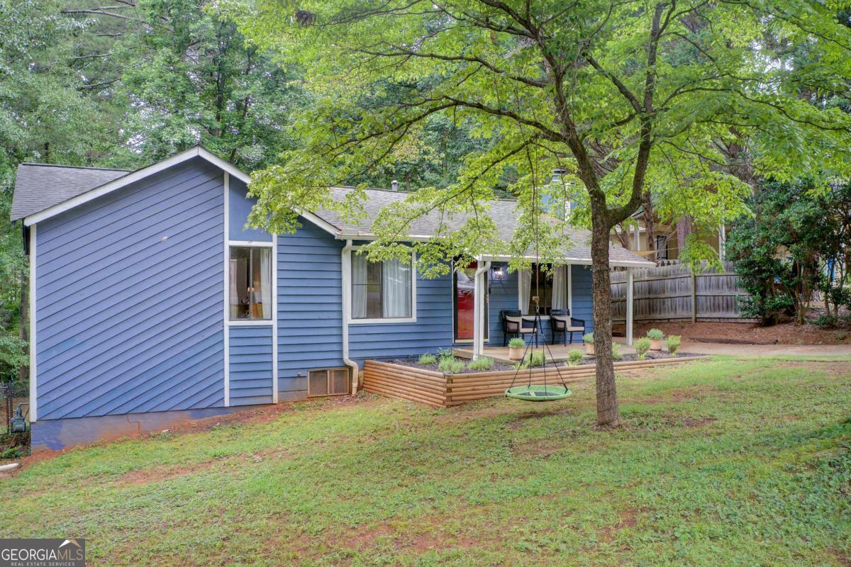 Beautifully updated 3-bedroom ranch in Duluth! Renovated kitchen with white cabinets and quartz countertop, updated bathrooms, new flooring, and a brand-new deck. Cozy wood-burning fireplace in the living room, plus a bright sunroom for year-round enjoyment. Fully fenced backyard, great for entertaining, pets, or playtime. Features include walk-in closets, a mudroom, and outdoor storage. Conveniently located near trails, lakes, Downtown Duluth, and Buford Hwy with shopping and dining options. Perfect as a starter home, investment property, or forever home. No HOA. Move-in ready, don't miss it!